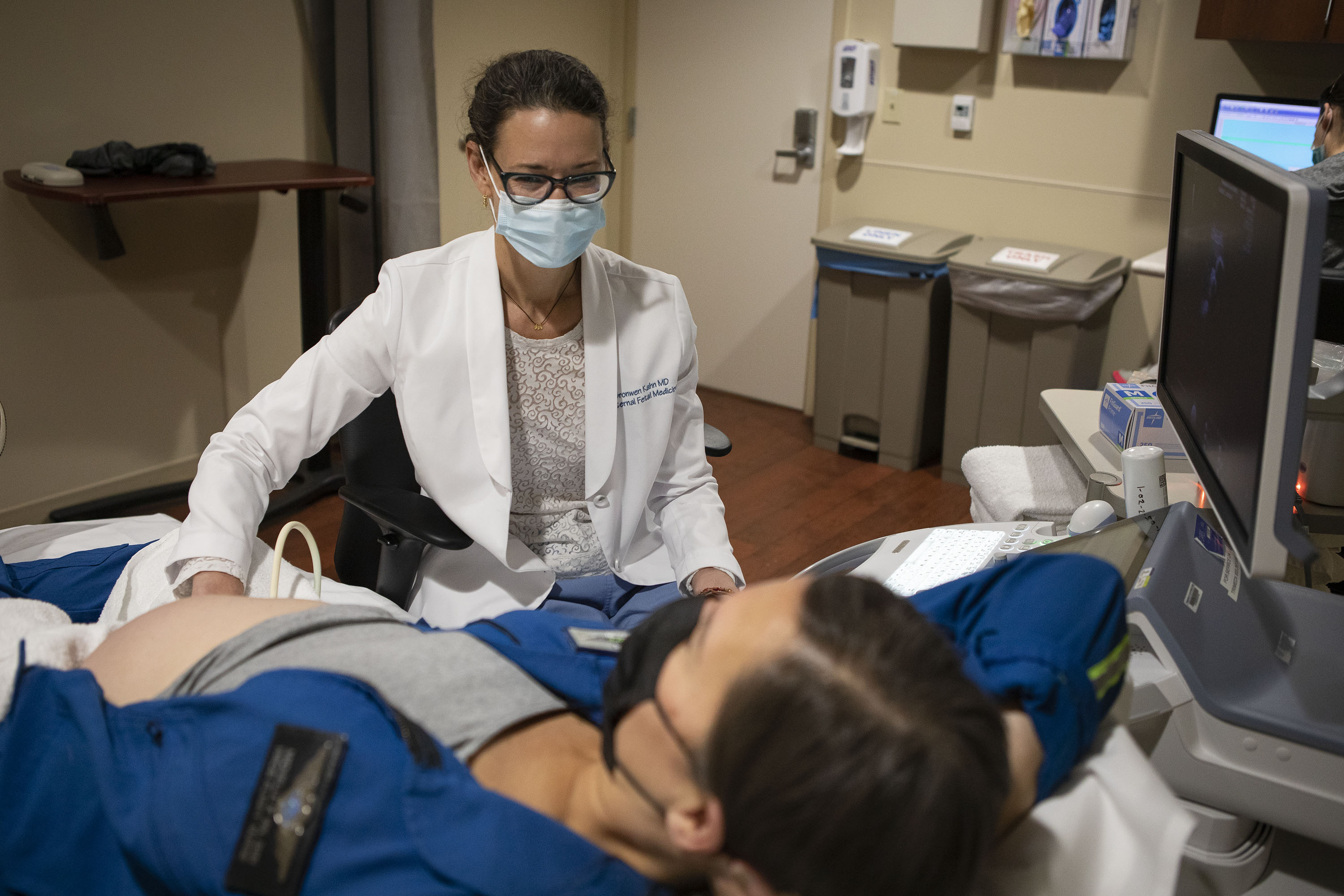 Dr. Bronwen Kahn performs an ultrasound on AirLife Denver flight nurse Michelle Krumrey, who is 30 weeks into her pregnancy, on Thursday, Dec. 9, 2021, at Presbyterian St. Luke's Medical Center in Denver, Colo. (Timothy Hurst/The Gazette) (Timothy Hurst)