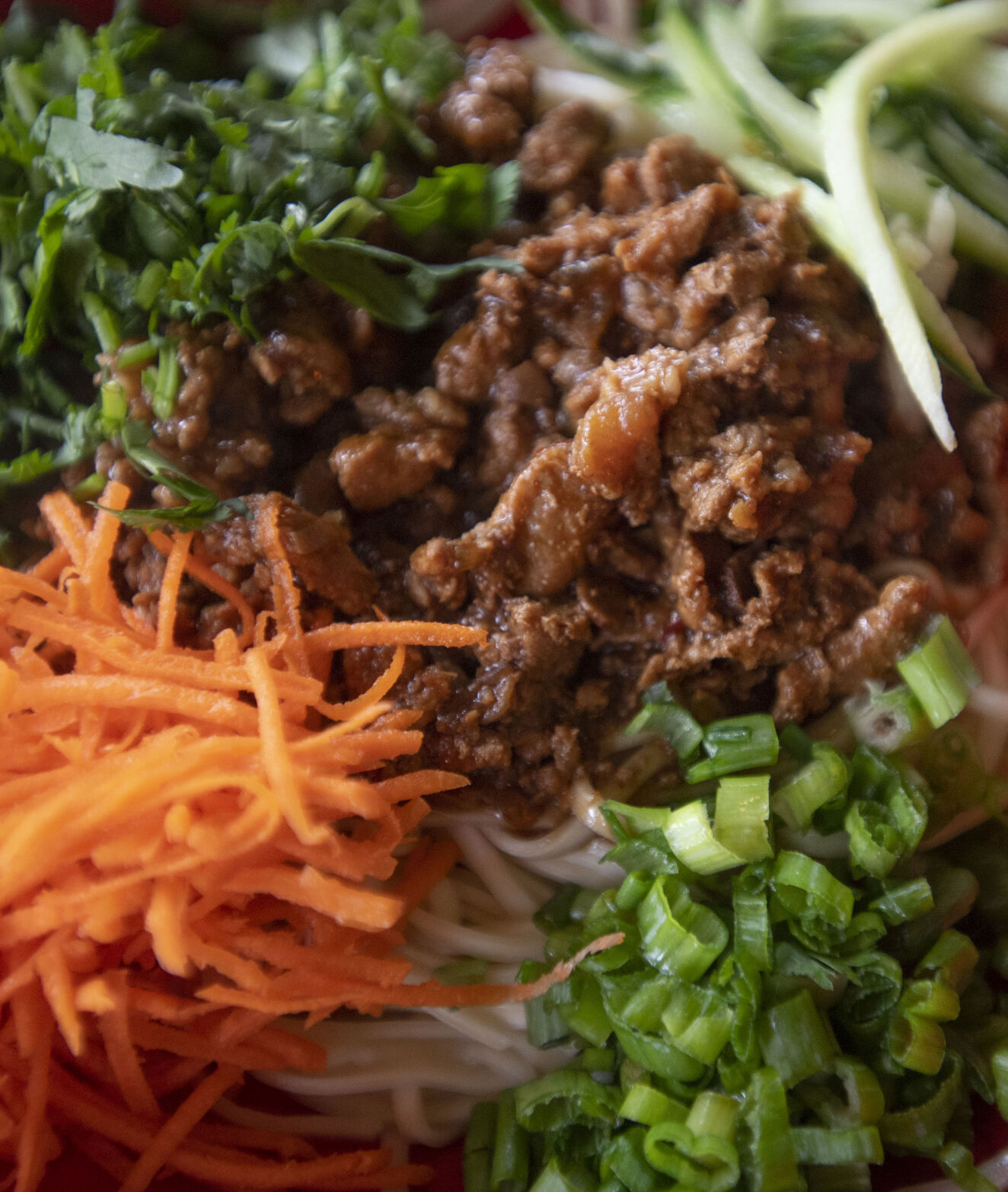 Za Jiang Mian dish, described as a classic northern Chinese noodle dish with fresh organic egg noodle topped with savory ground pork sauce and julienne vegetables at Zoe Ma Ma in Boulder. (Chancey Bush, The Gazette)