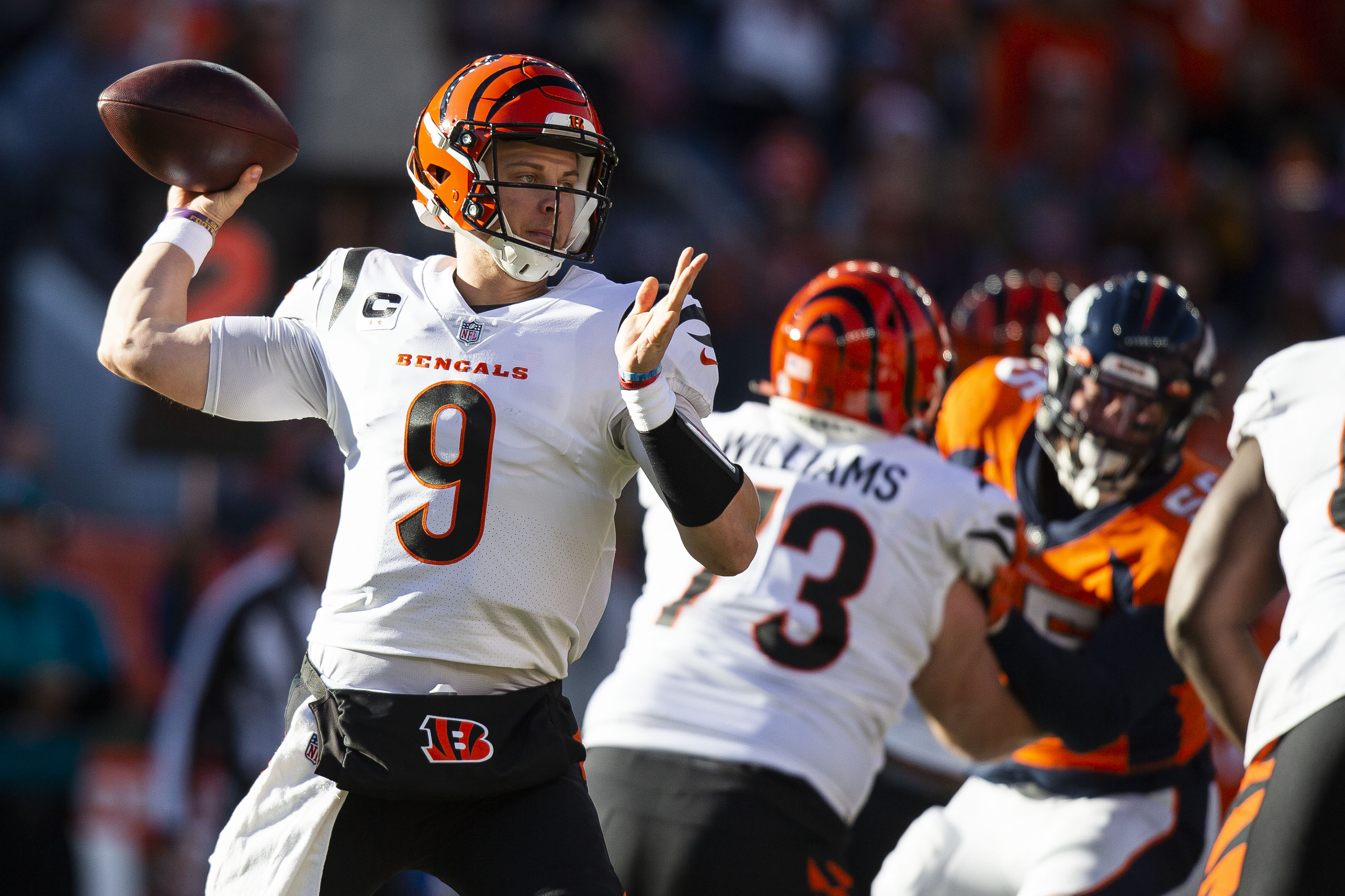 Cincinnati Bengals quarterback Joe Burrow (9) throws during a game against the Denver Broncos on Sunday, Dec. 19, 2021, at Empower Field at Mile High in Denver, Colo. (Timothy Hurst/The Gazette) (TimHursttim.hurst@gazette.comhttps://secure.gravatar.com/avatar/aca82bd62b4ee425c598527cd6faa1b1?d=mm&r=g)