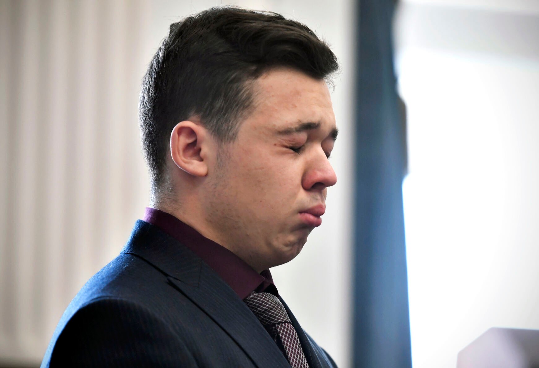 SEAN KRAJACIC, The Kenosha News via AP pool Kyle Rittenhouse tears up as he is found not guilty on all counts at the Kenosha County Courthouse on Nov. 19. (SEAN KRAJACIC, The Kenosha News via AP pool)