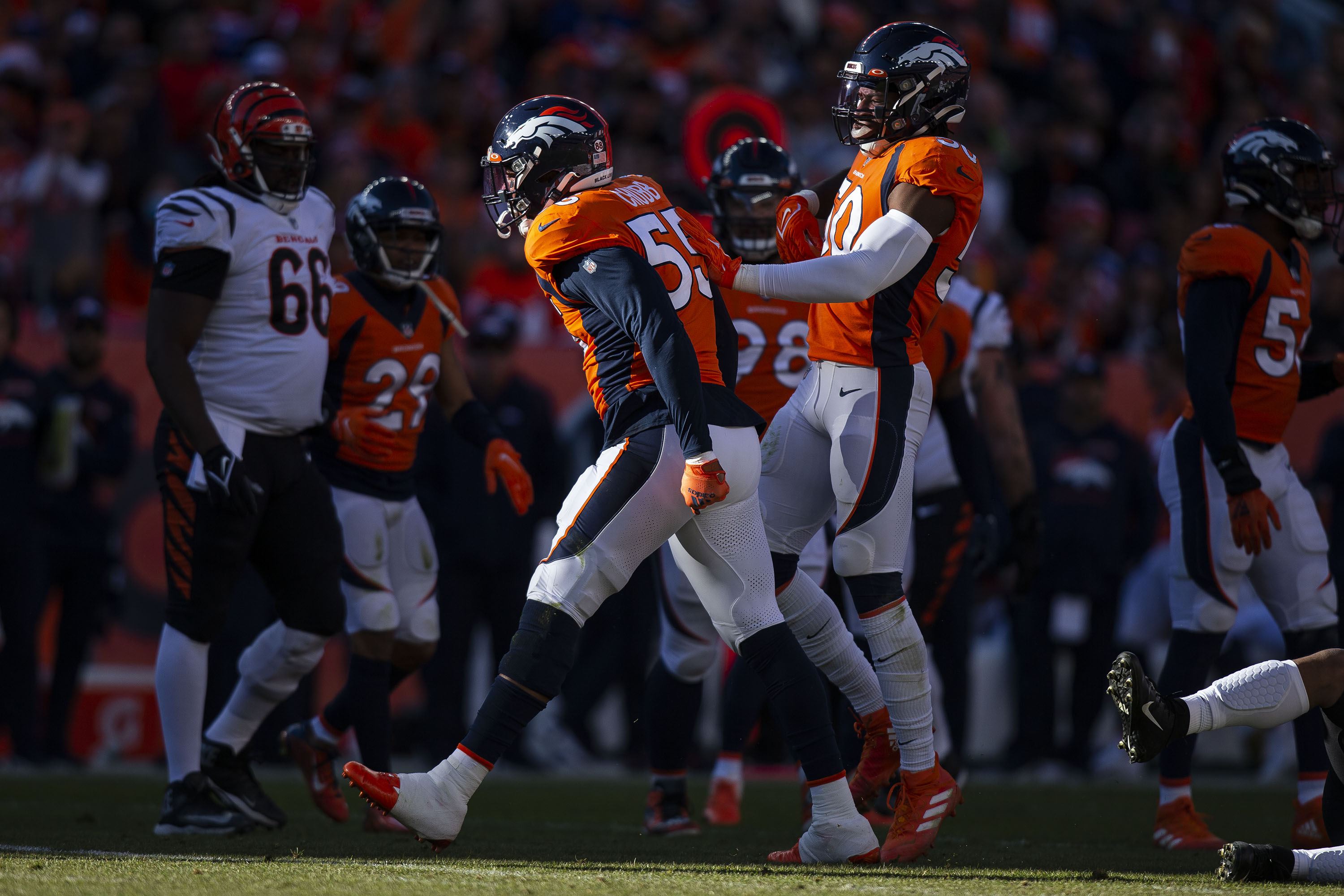Denver Broncos outside linebacker Bradley Chubb (55) and inside linebacker Jonas Griffith (50) celebrate a tackle for loss against the Cincinnati Bengals on Sunday, Dec. 19, 2021, at Empower Field at Mile High in Denver, Colo. (Timothy Hurst/The Gazette) (TimHursttim.hurst@gazette.comhttps://secure.gravatar.com/avatar/aca82bd62b4ee425c598527cd6faa1b1?d=mm&r=g)