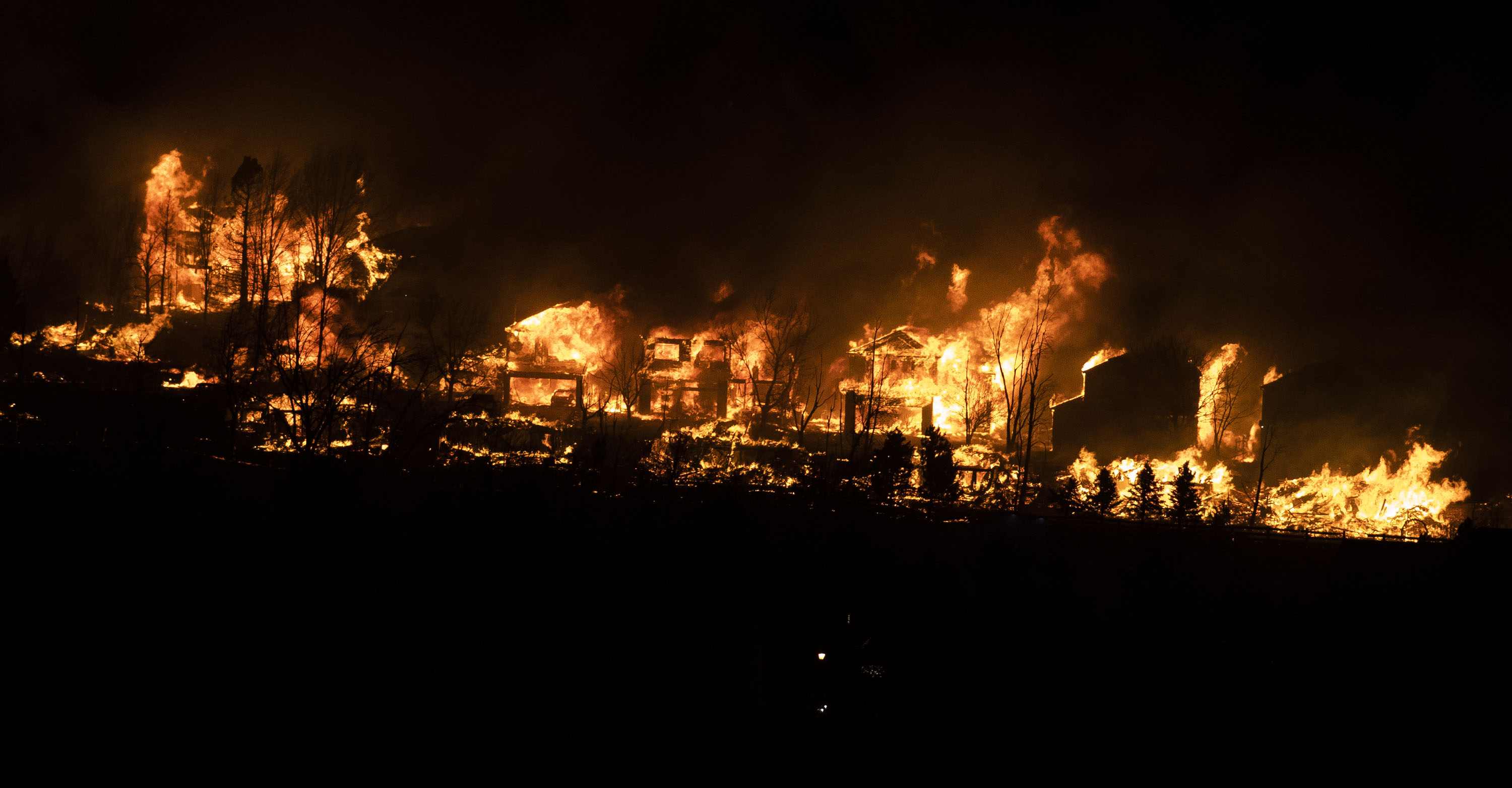 A large fire burns down a row of homes near McCaslin Boulevard and West 120th Avenue on Thursday, Dec. 30, 2021, in Superior, Colo. (Timothy Hurst/The Gazette) (Timothy Hurst)