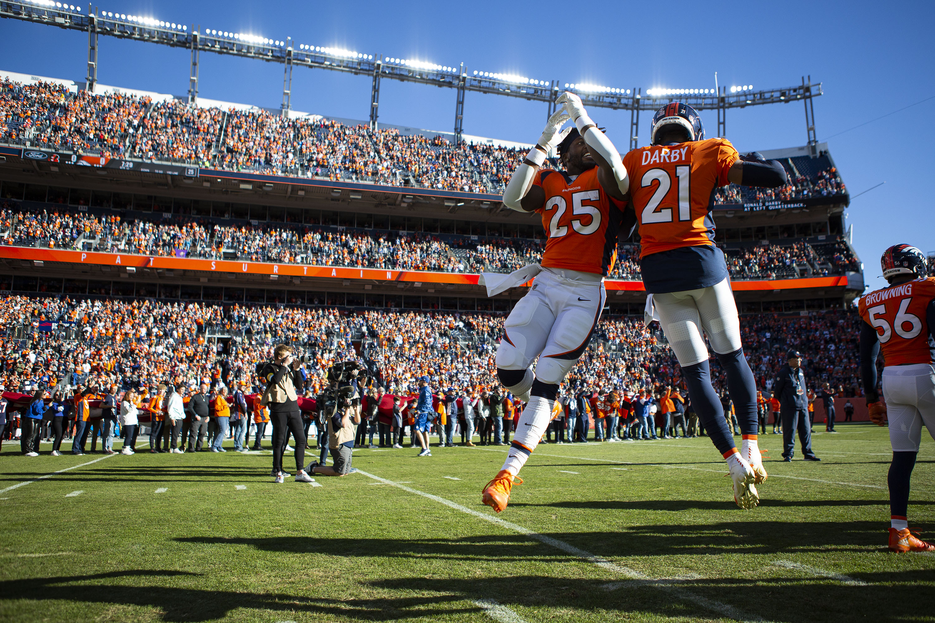 Denver Broncos running back Melvin Gordon III (25) and cornerback Ronald Darby (21) are introduced before a game against the Cincinnati Bengals on Sunday, Dec. 19, 2021, at Empower Field at Mile High in Denver, Colo. (Timothy Hurst/The Gazette) (TimHursttim.hurst@gazette.comhttps://secure.gravatar.com/avatar/aca82bd62b4ee425c598527cd6faa1b1?d=mm&r=g)