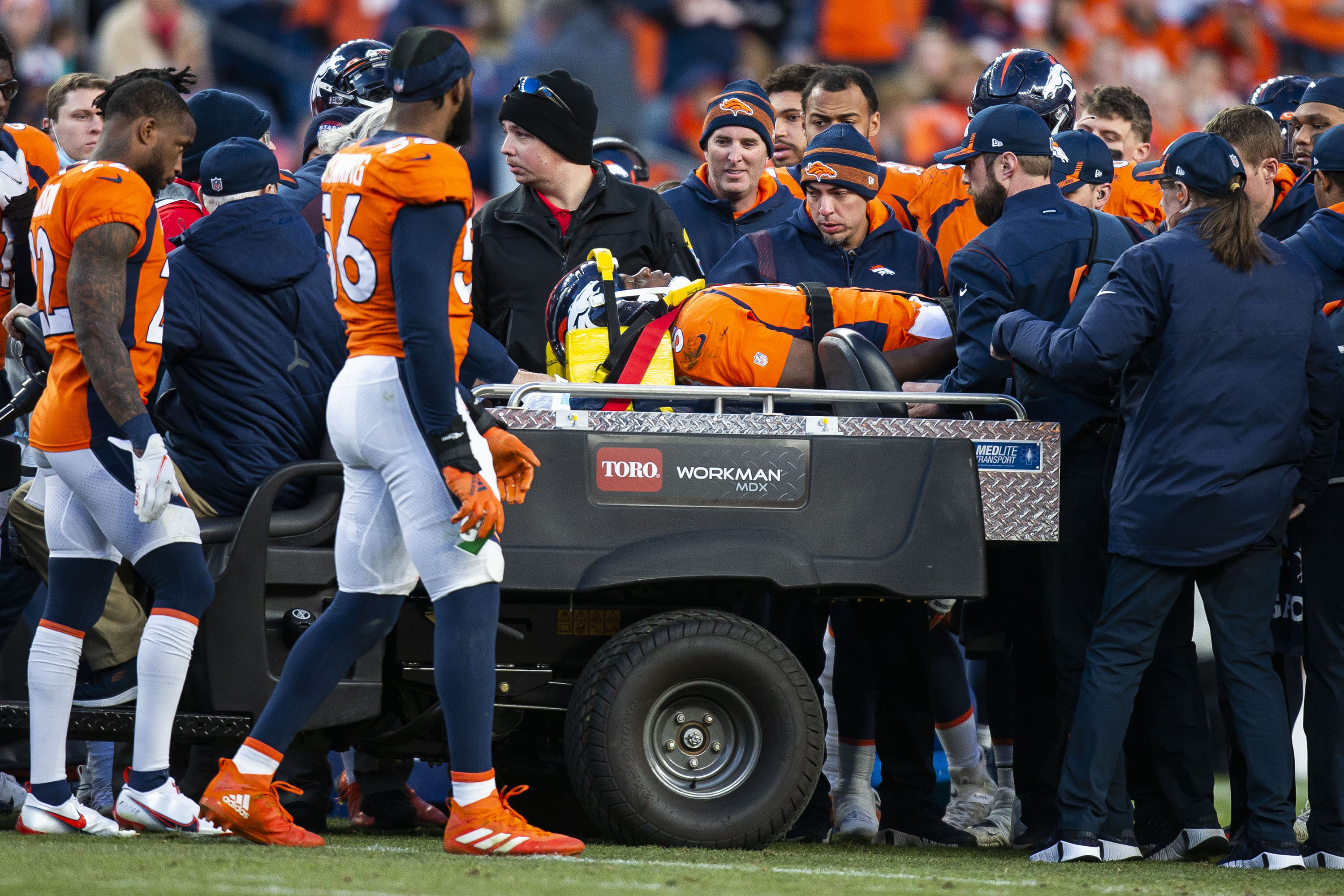 Denver Broncos quarterback Teddy Bridgewater (5) is carted off the field after sustaining an injury while running the ball against the Cincinnati Bengals on Sunday, Dec. 19, 2021, at Empower Field at Mile High in Denver, Colo. (Timothy Hurst/The Gazette) (Timothy Hurst)
