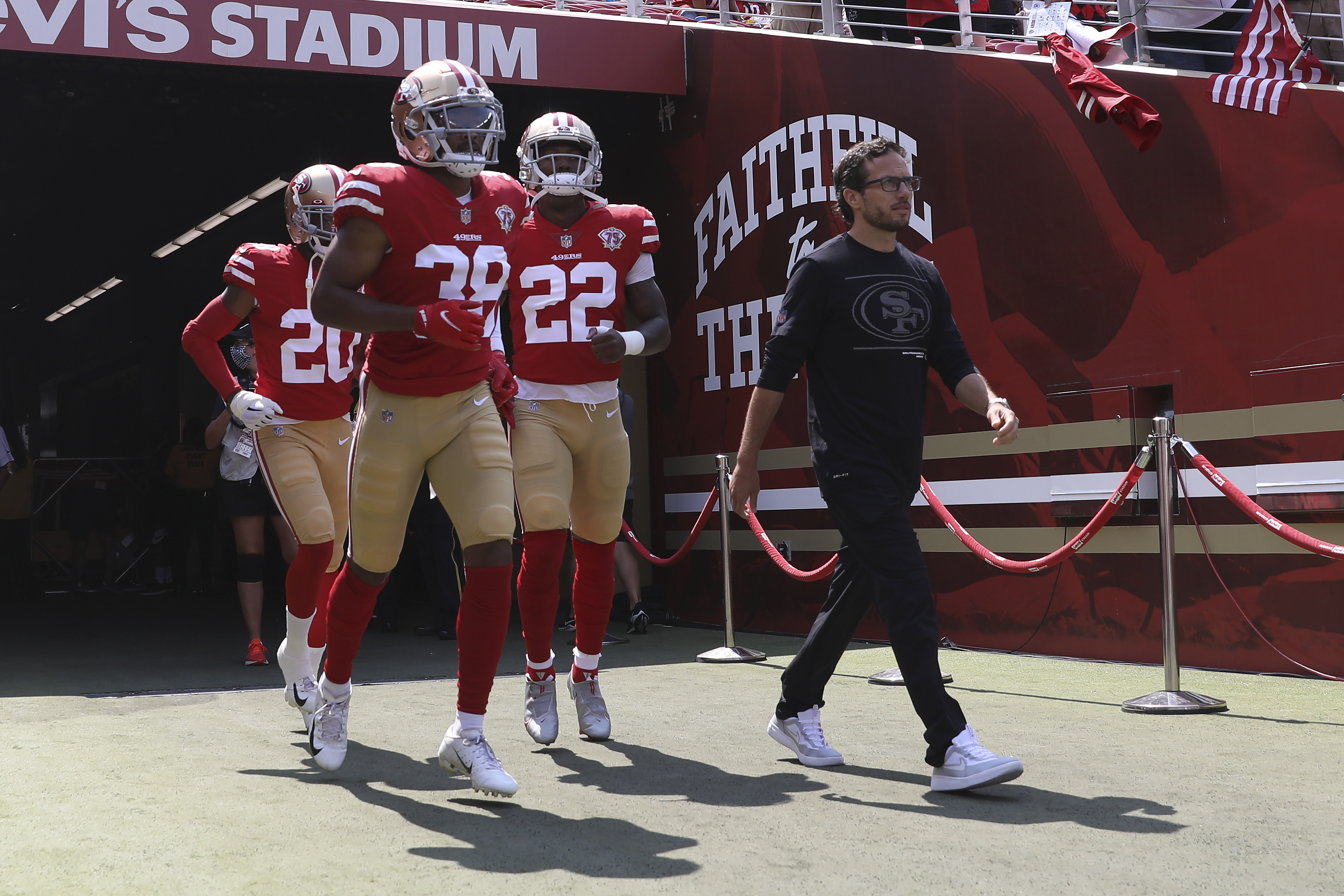 San Francisco 49ers offensive coordinator Mike McDaniel, right, walks onto the field with Ambry Thomas (20), cornerback Deommodore Lenoir (38) and running back Wayne Gallman II (22) before an NFL preseason football game against the Las Vegas Raiders in Santa Clara, Calif., Sunday, Aug. 29, 2021. (AP Photo/Jed Jacobsohn) (Jed Jacobsohn)