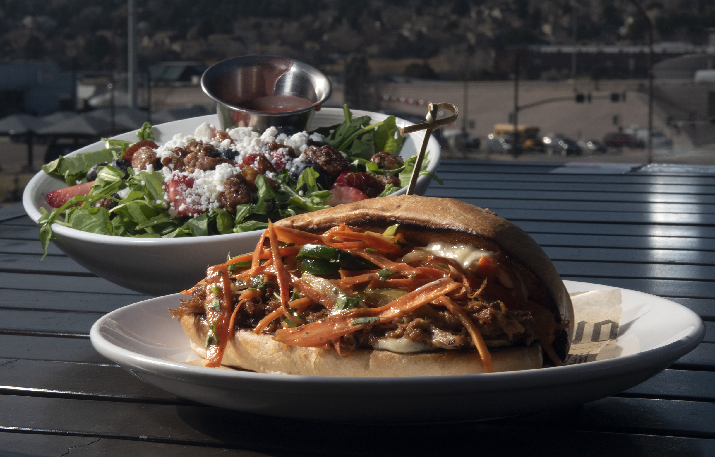 ViewHouse Restaurant (Located at: 7114 Campus Dr.) “Nuts and Berries Salad with Bahn Mi Pork Sandwich” Wednesday December 1, 2021. Photo by Jeff Kearney. (Jeff Kearney)
