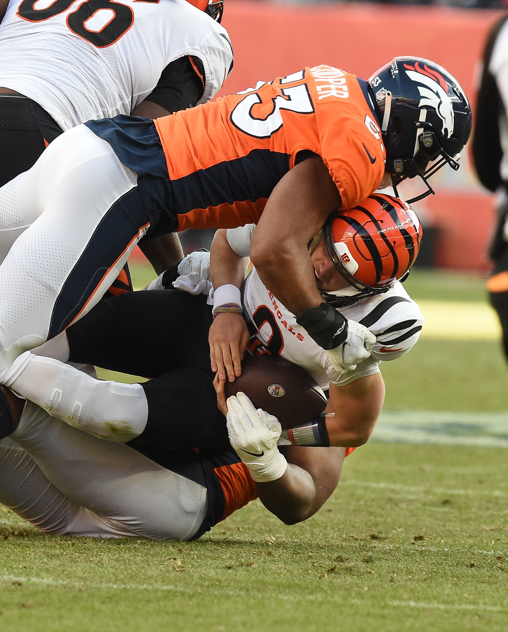 Broncos linebacker Jonathan Cooper and defensive end Shelby Harris sack Bengals quarterback Joe Burrow in the second quarter. The Broncos played the Bengals at Mile High Stadium on Sunday, Dec. 19, 2021. The Broncos lost the game 15-10. (Photo by Jerilee Bennett, The Gazette) (Jerilee Bennett)