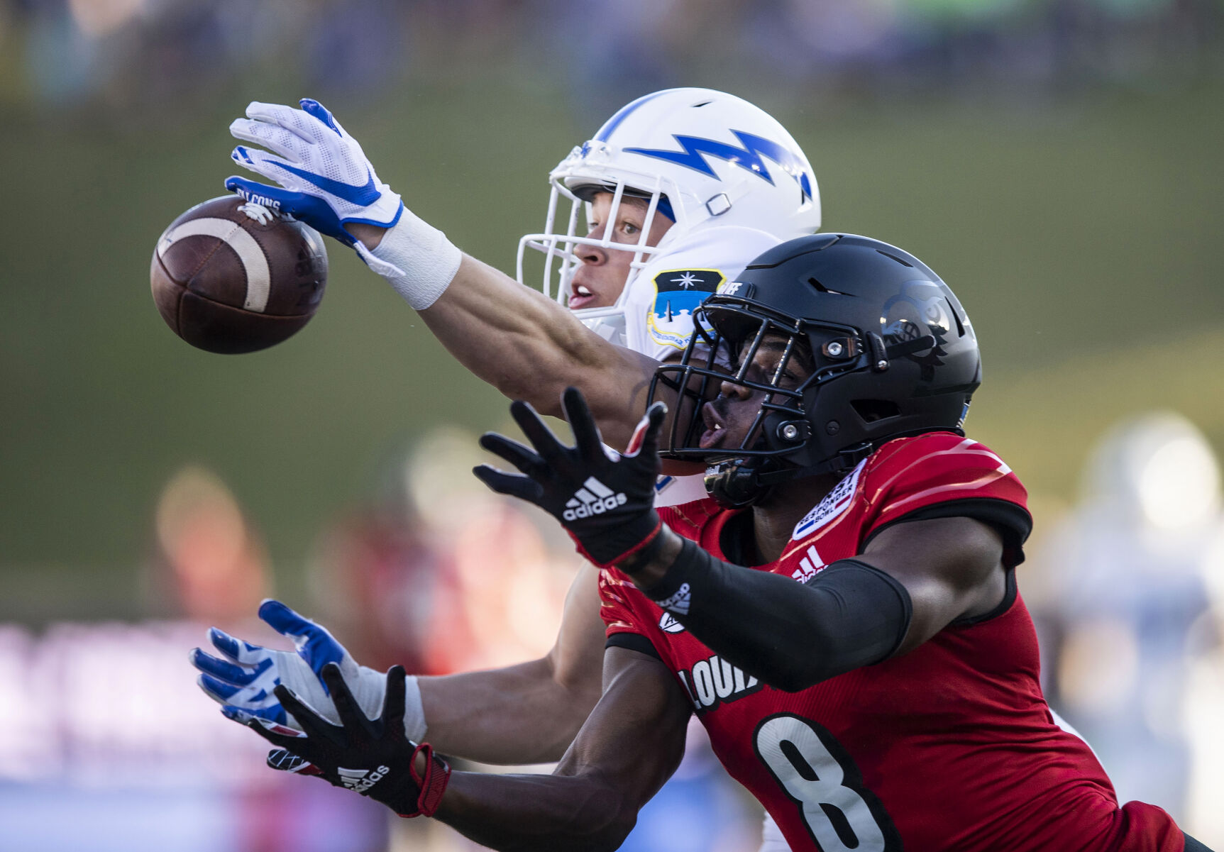 Air Force senior Tre Bugg III (3) breaks up a pass intended for Louisville senior Tyler Harrell (8) during the second quarter as the Air Force Falcons take on the Louisville Cardinals during the 2021 First Responder Bowl at Gerald J. Ford Stadium on the campus of Southern Methodist University in Dallas, Texas on Tuesday, Dec. 28, 2021. (Chancey Bush/ The Gazette) (Chancey Bush/ The Gazette)