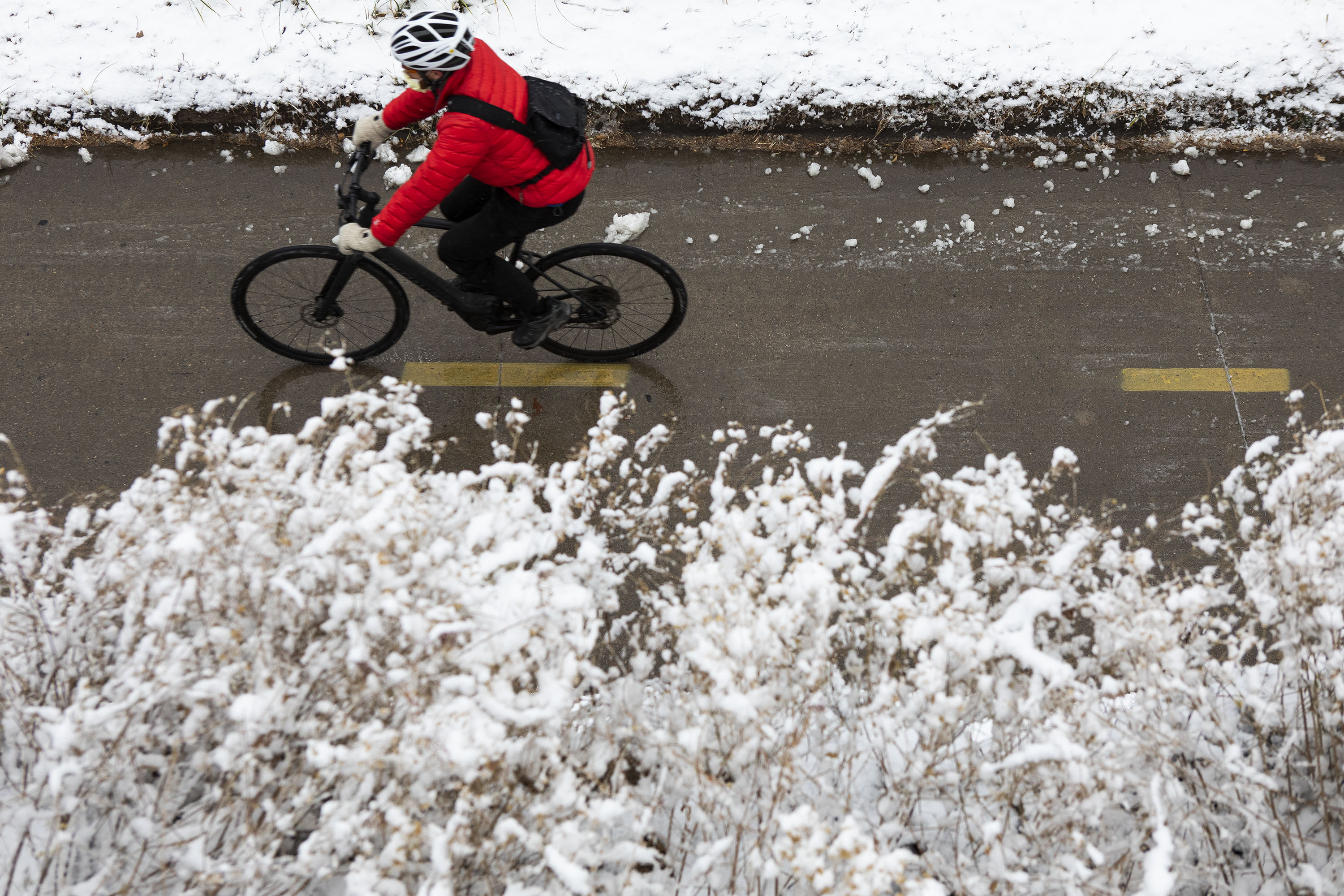A cyclist makes their way north on Cherry Creek Trail on Friday, Dec. 10, 2021, in Denver. (Timothy Hurst, The Gazette)