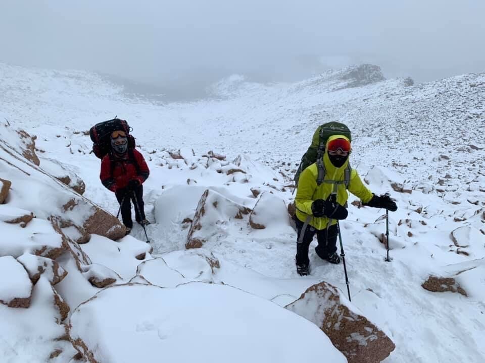Priscilla Clayton, in yellow jacket, hikes a snowy New Year's Eve climb up Pikes Peak with the AdAmAn Club. Clayton is the club's new member for this year's climb. Photo courtesy Priscilla Clayton