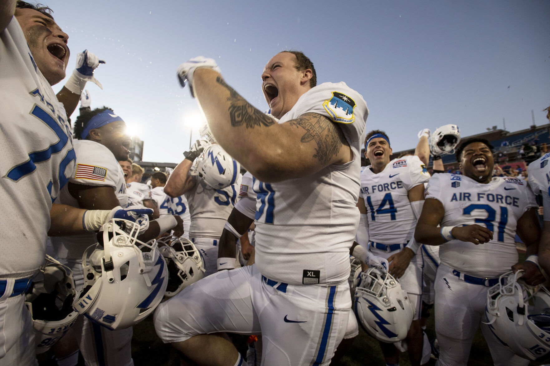 Air Force Falcons celebrate after defeating the Louisville Cardinals during the 2021 First Responder Bowl at Gerald J. Ford Stadium on the campus of Southern Methodist University in Dallas, Texas on Tuesday, Dec. 28, 2021. The Falcons defeated the Cardinals and won the bowl game by a score of 31-28. (Chancey Bush/ The Gazette) (Chancey Bush/ The Gazette)