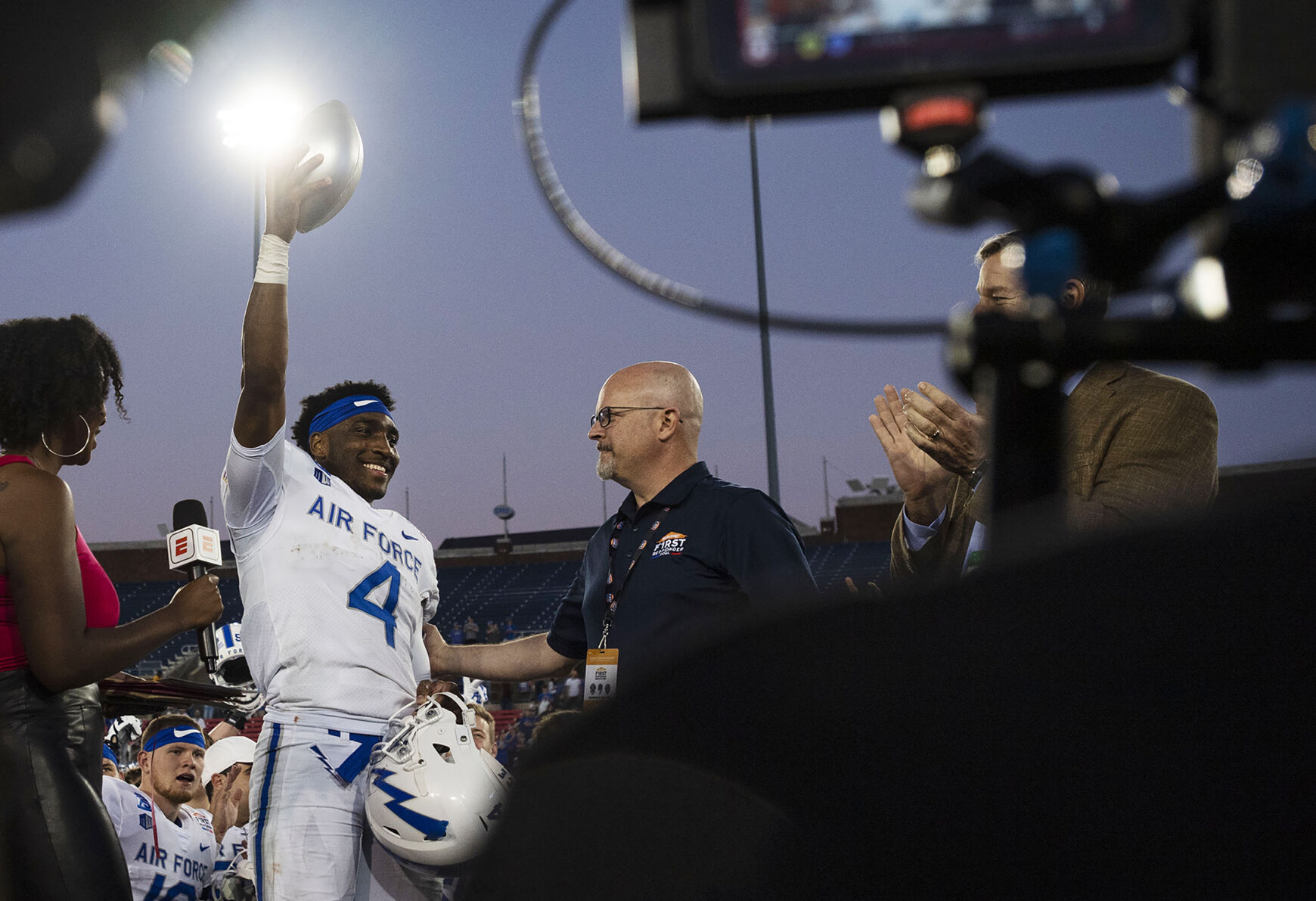 Air Force senior quarterback Haaziq Daniels is selected as MVP as he holds up his trophy in celebration with the rest of the team after the Air Force Falcons defeat the Louisville Cardinals during the 2021 First Responder Bowl at Gerald J. Ford Stadium on the campus of Southern Methodist University in Dallas, Texas on Tuesday, Dec. 28, 2021. The Falcons defeated the Cardinals and won the bowl game by a score of 31-28. (Chancey Bush/ The Gazette) (Chancey Bush/ The Gazette)
