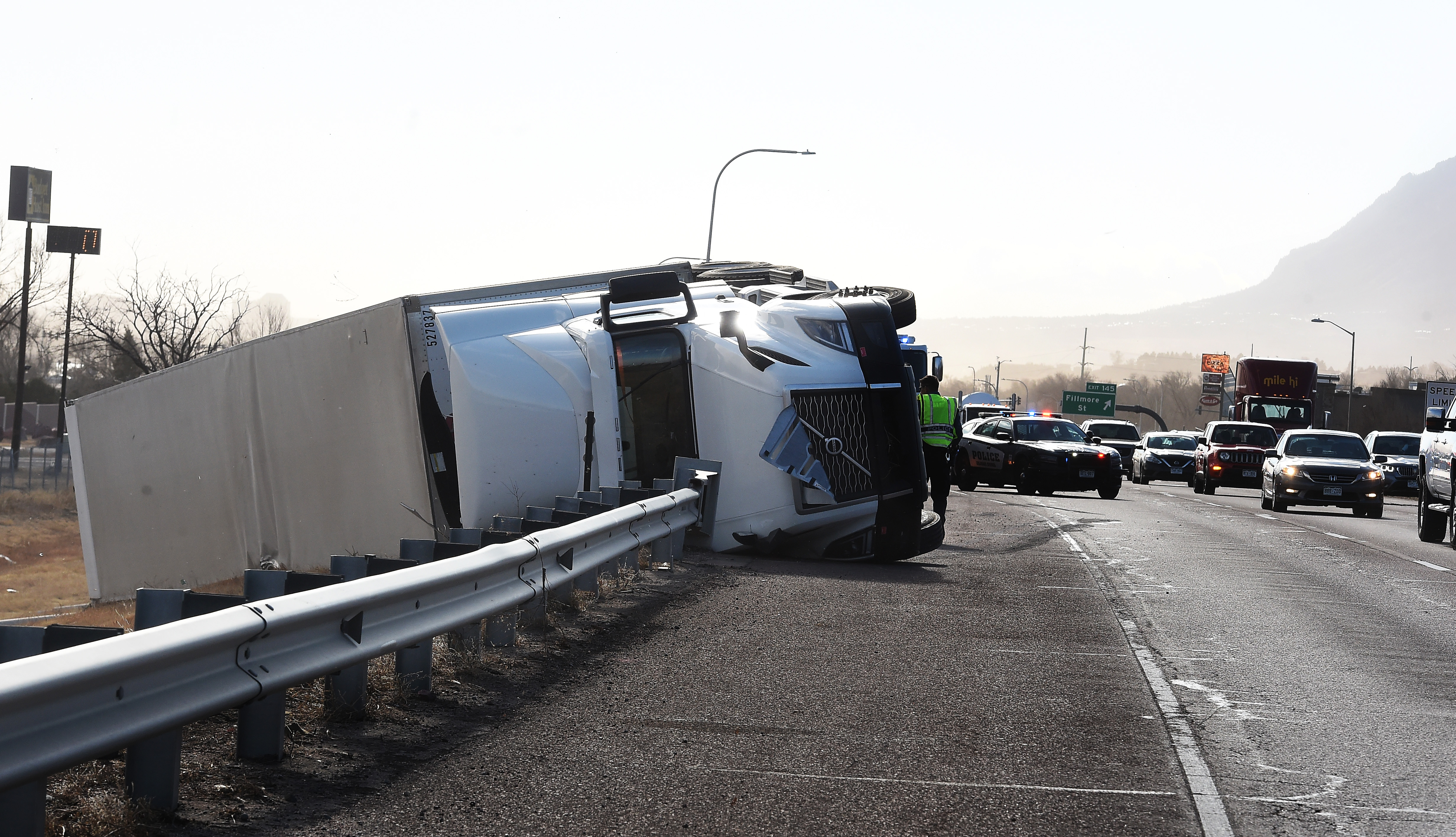 High winds toppled a semi-truck on I-25 in the northbound lane just past Garden of the Gods Rd. on Wednesday, Dec. 15, 2021. (Photo by Jerilee Bennett, The Gazette) (Jerilee Bennett)