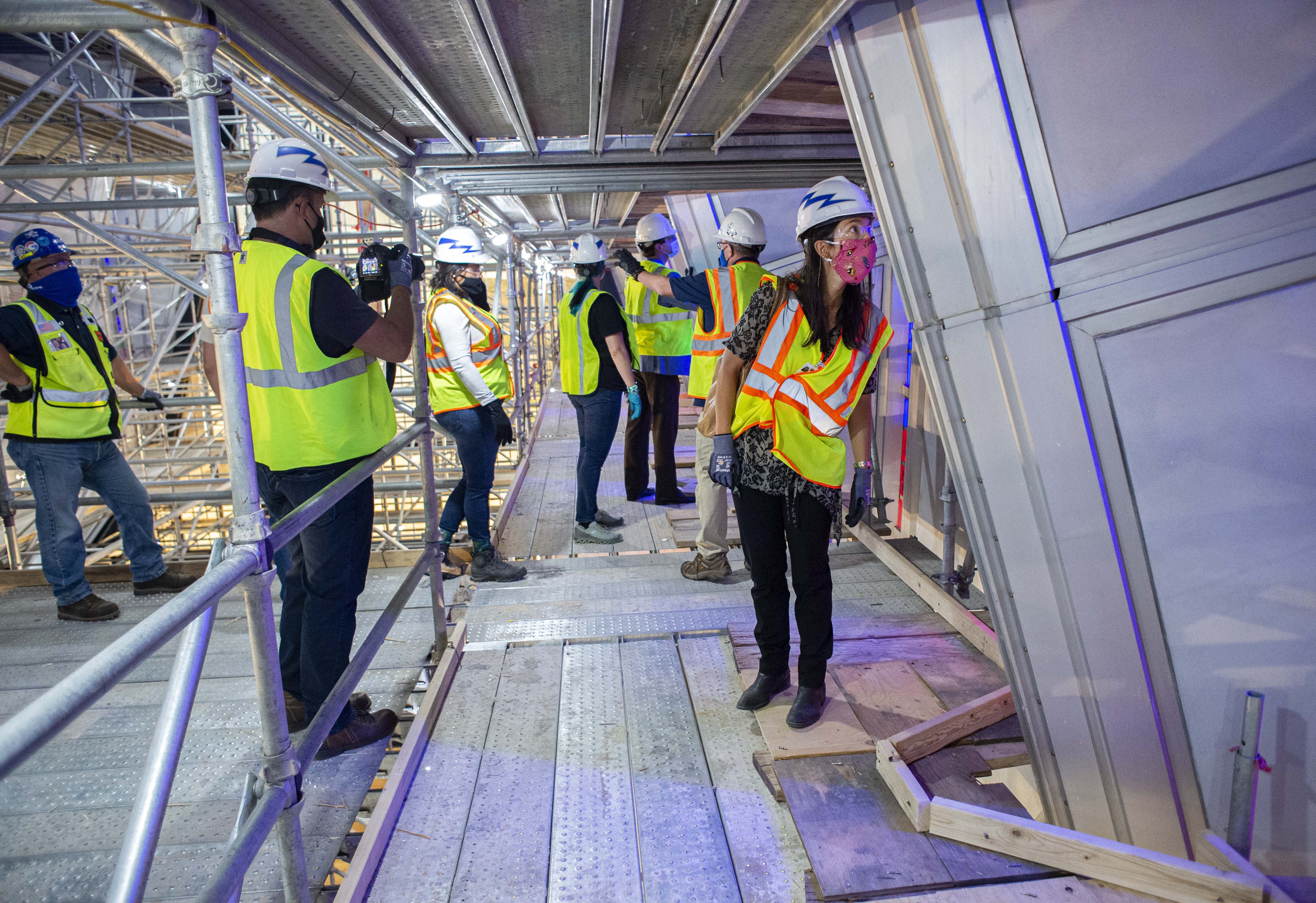 U.S. Air Force Academy architect Daniela Lawrence takes a closer look at Cadet Chapel’s stained glass from the scaffolding high above the main floor on Aug. 7, 2020 during a tour of its restoration and renovation as part of Denver Modernism Week. (Christian Murdock, The Gazette)