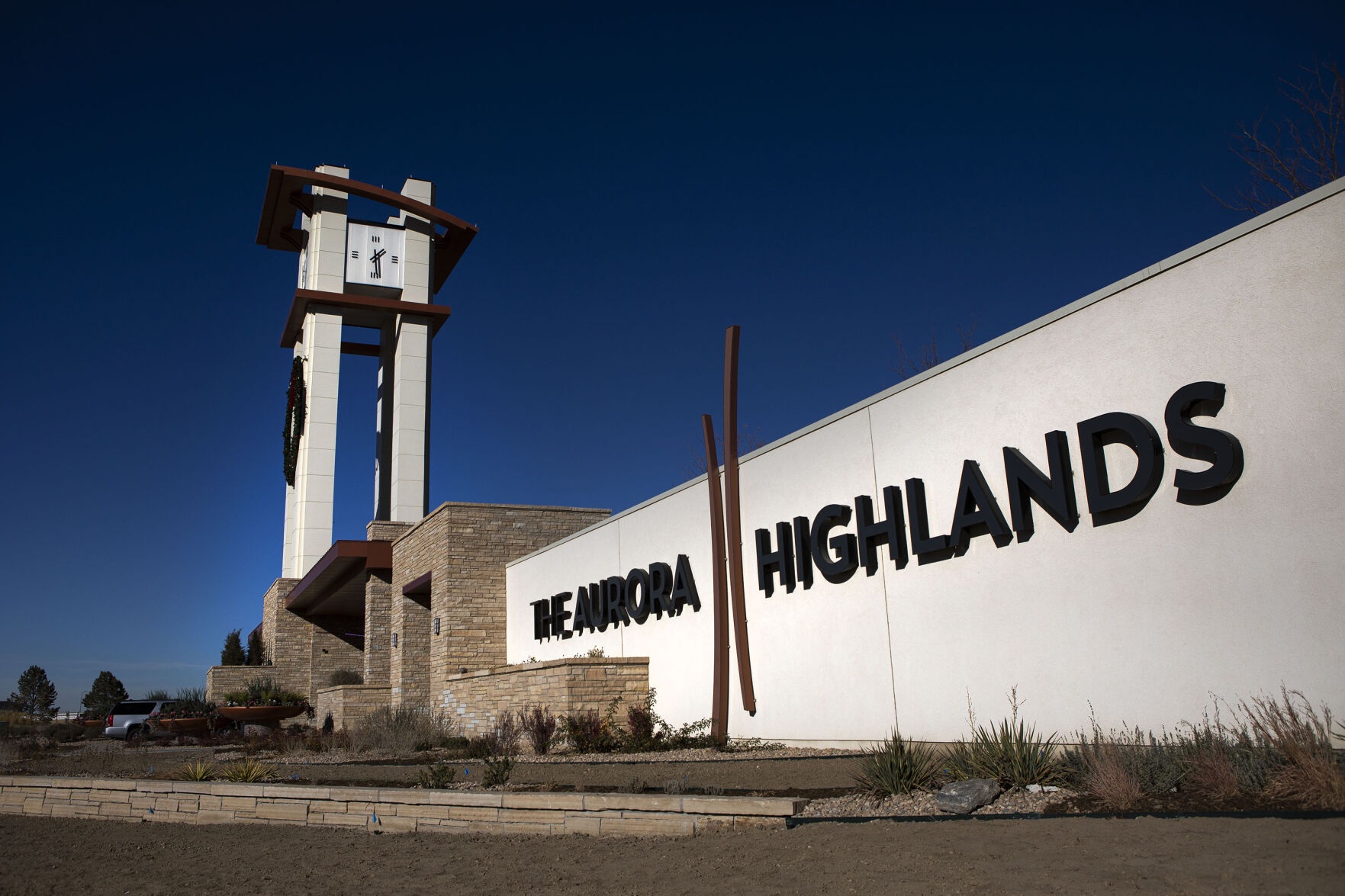 A large gate and clocktower mark the entrance to the Aurora Highlands Metro District in Aurora. (Timothy Hurst, The DENVER Gazette)