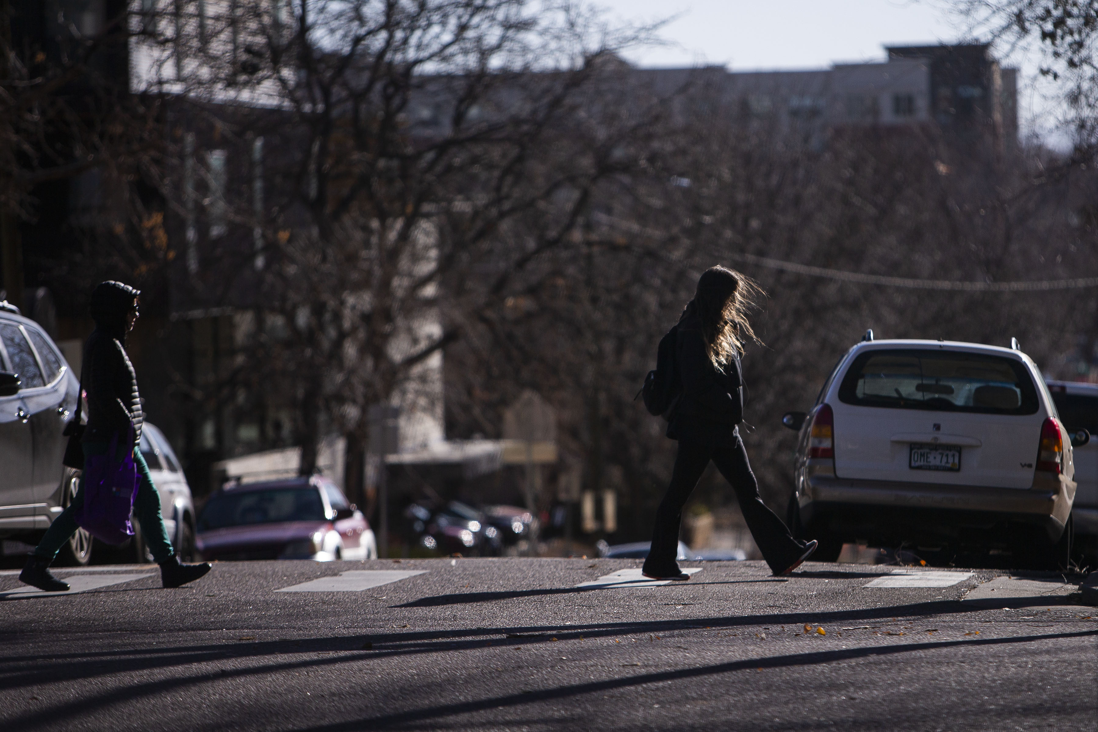 A pedestrian’s hair blows in front of her face while walking on Wednesday, Dec. 15, 2021, in Denver, Colo. (Timothy Hurst/The Gazette) (Timothy Hurst)
