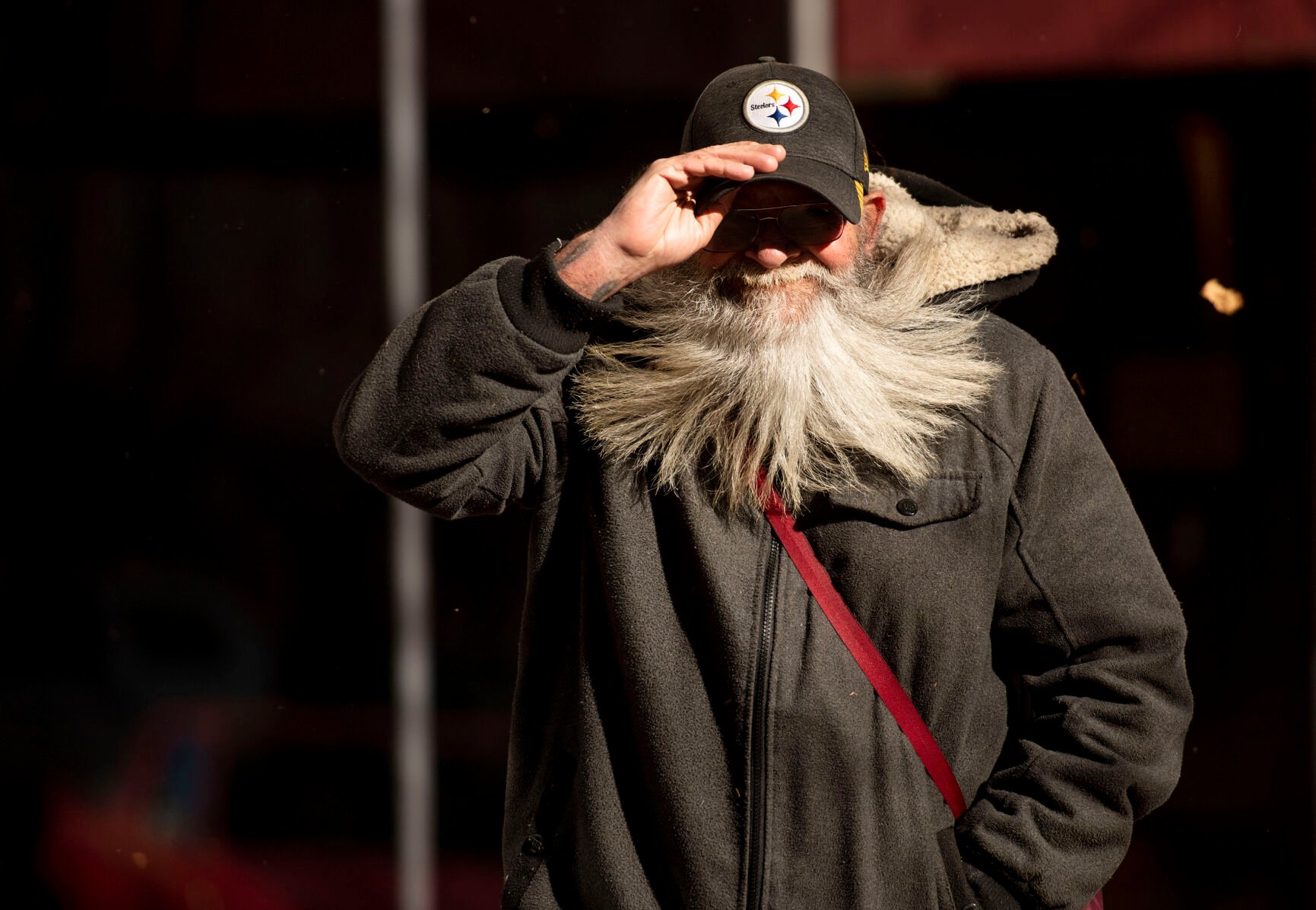 Michael Forbis holds onto his hat as he walks through strong wind gusts in downtown Colorado Springs during a wind storm that swept through El Paso County on Wednesday, Dec. 15, 2021. (Chancey Bush/ The Gazette) (Chancey Bush/ The Gazette)
