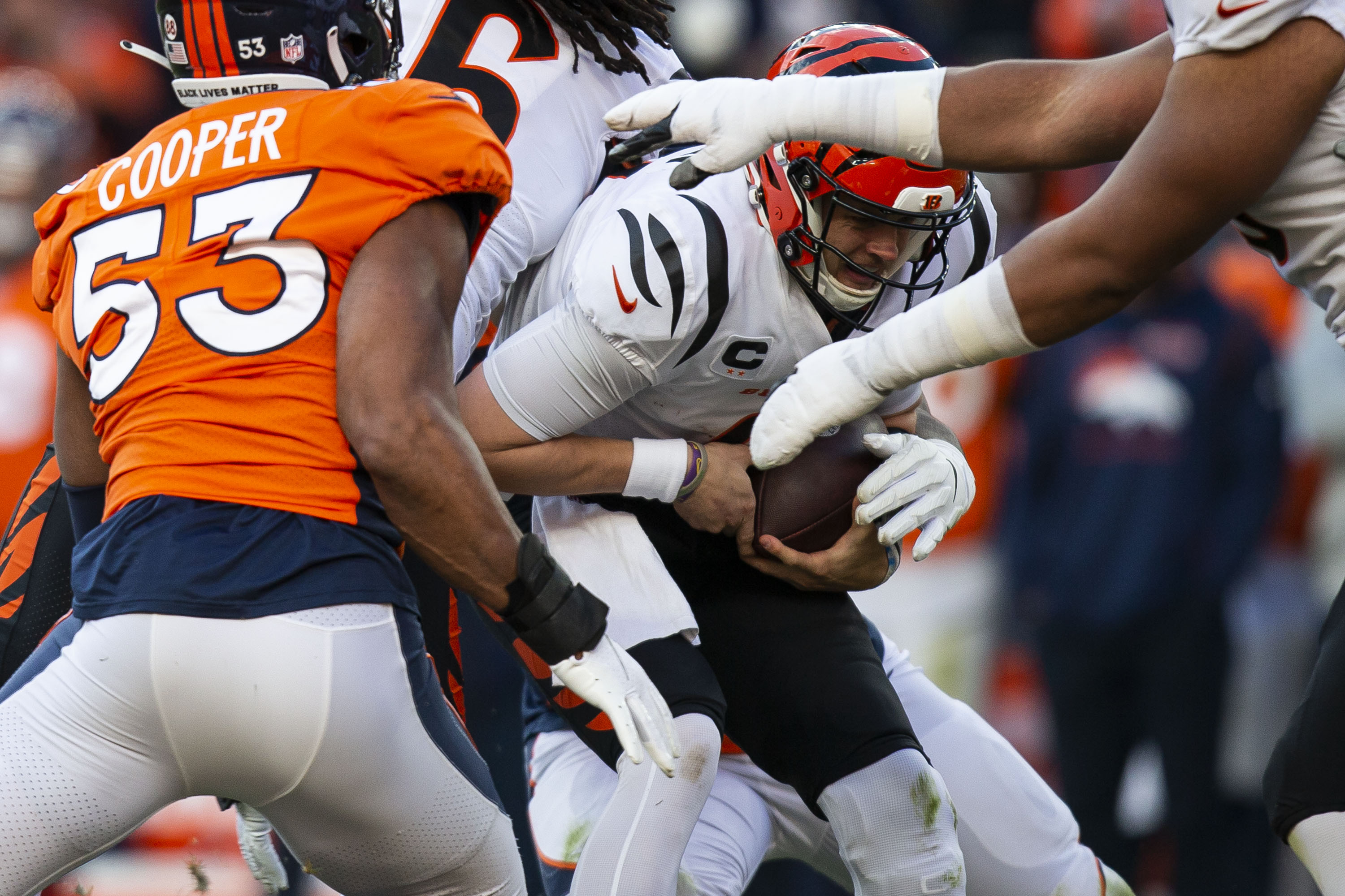 Denver Broncos defensive end Shelby Harris (96) reaches out and sacks Cincinnati Bengals quarterback Joe Burrow (9) on Sunday, Dec. 19, 2021, at Empower Field at Mile High in Denver, Colo. (Timothy Hurst/The Gazette) (TimHursttim.hurst@gazette.comhttps://secure.gravatar.com/avatar/aca82bd62b4ee425c598527cd6faa1b1?d=mm&r=g)
