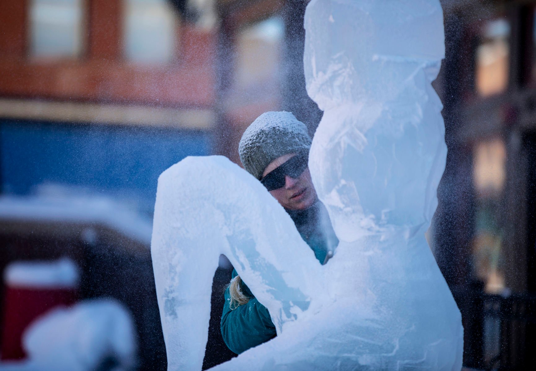 Julie Eslinger works on a fairy with her team Ice Cubed of Denver's Mystical Creatures theme during the 13th annual Cripple Creek Ice Festival in Cripple Creek, Colo., on Saturday, Feb. 8, 2020. This year, ice sculptors will be competing for a “People’s Choice” cash prize, where the public can vote for the best carving. The artists will continue their creations Sunday and next weekend. The winning team will be announced on February 16th. (Chancey Bush/ The Gazette) (Chancey Bush The Gazette)