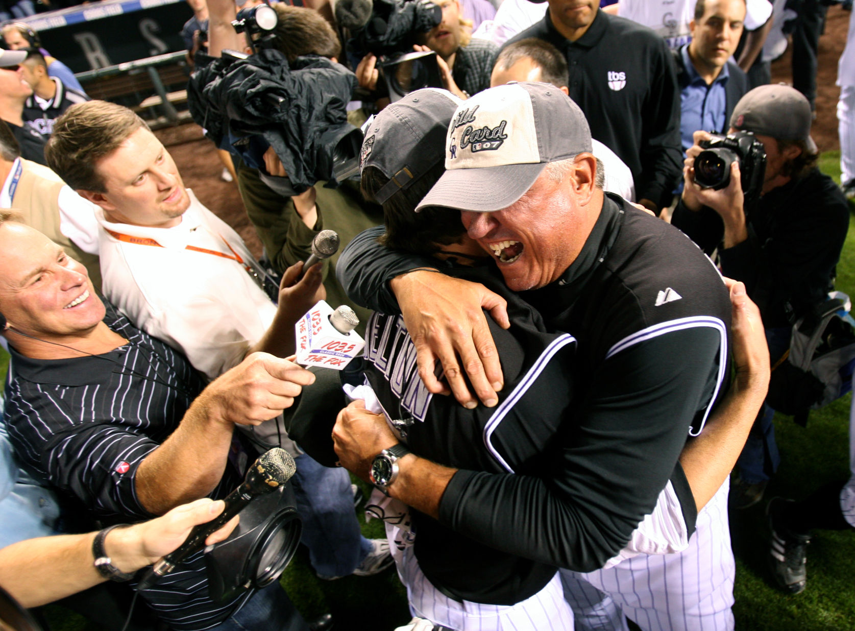 Skipper Clint Hurdle and Todd Helton embrace after winning as Rockies players celebrate their first playoff berth since 1995. The Colorado Rockies defeated the San Diego Padres 9-8 in 13 innings to send them to the NLDS Monday October 1, 2007 at Coors Field in Denver, Colorado. PHOTO BY: TODD SPOTH (TODD SPOTH)