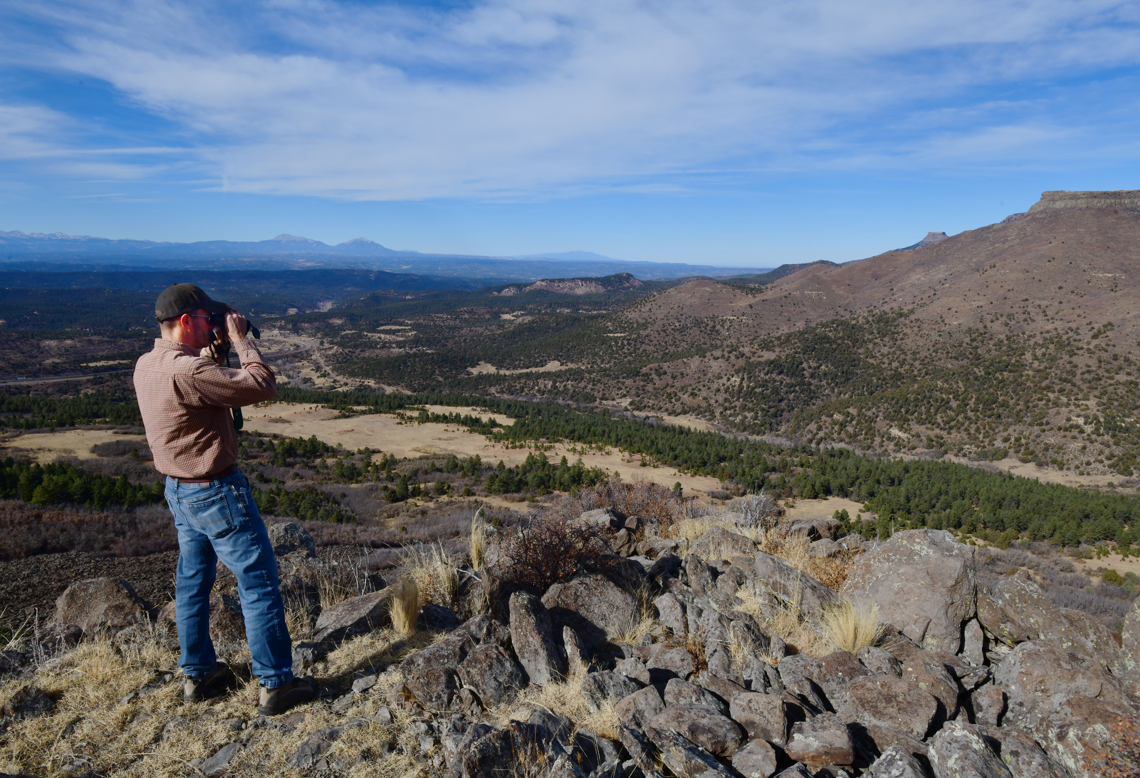 From a high meadow in the future Colorado state park, Matt Moorhead with The Nature Conservancy looks for the abundant wildlife. Elevations in the park range from 6,000 feet to 9,600 feet. The area is home to a wide range of habitats, including a year-round elk herd. (photos by JERILEE BENNETT, THE GAZETTE/)