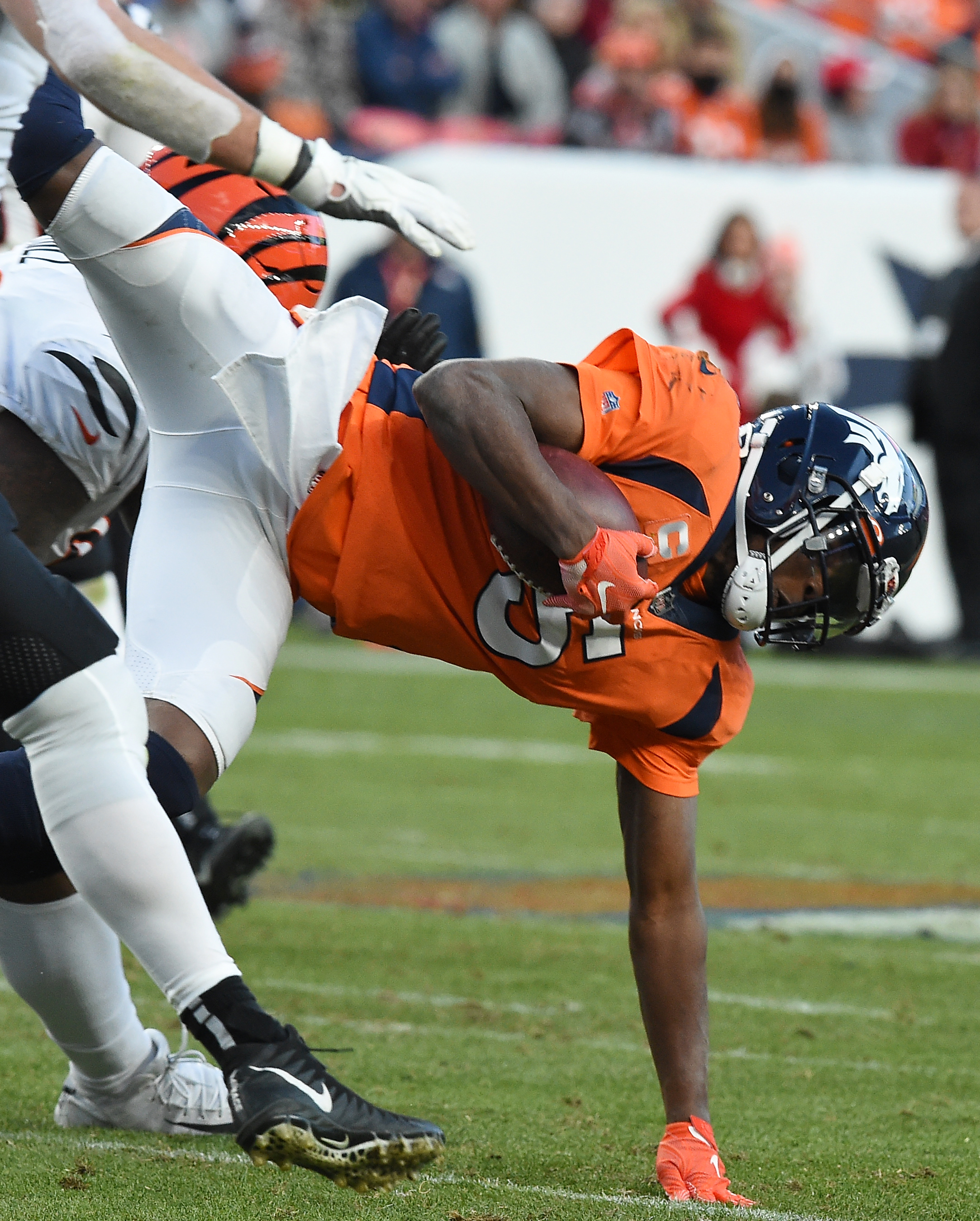 Broncos quarterback Teddy Bridgewater is upended on a running play, a play that ended his game. He was carted off the field in a neck brace. The Broncos played the Bengals at Mile High Stadium on Sunday, Dec. 19, 2021. The Broncos lost the game 15-10.(Photo by Jerilee Bennett, The Gazette) (Jerilee Bennett)