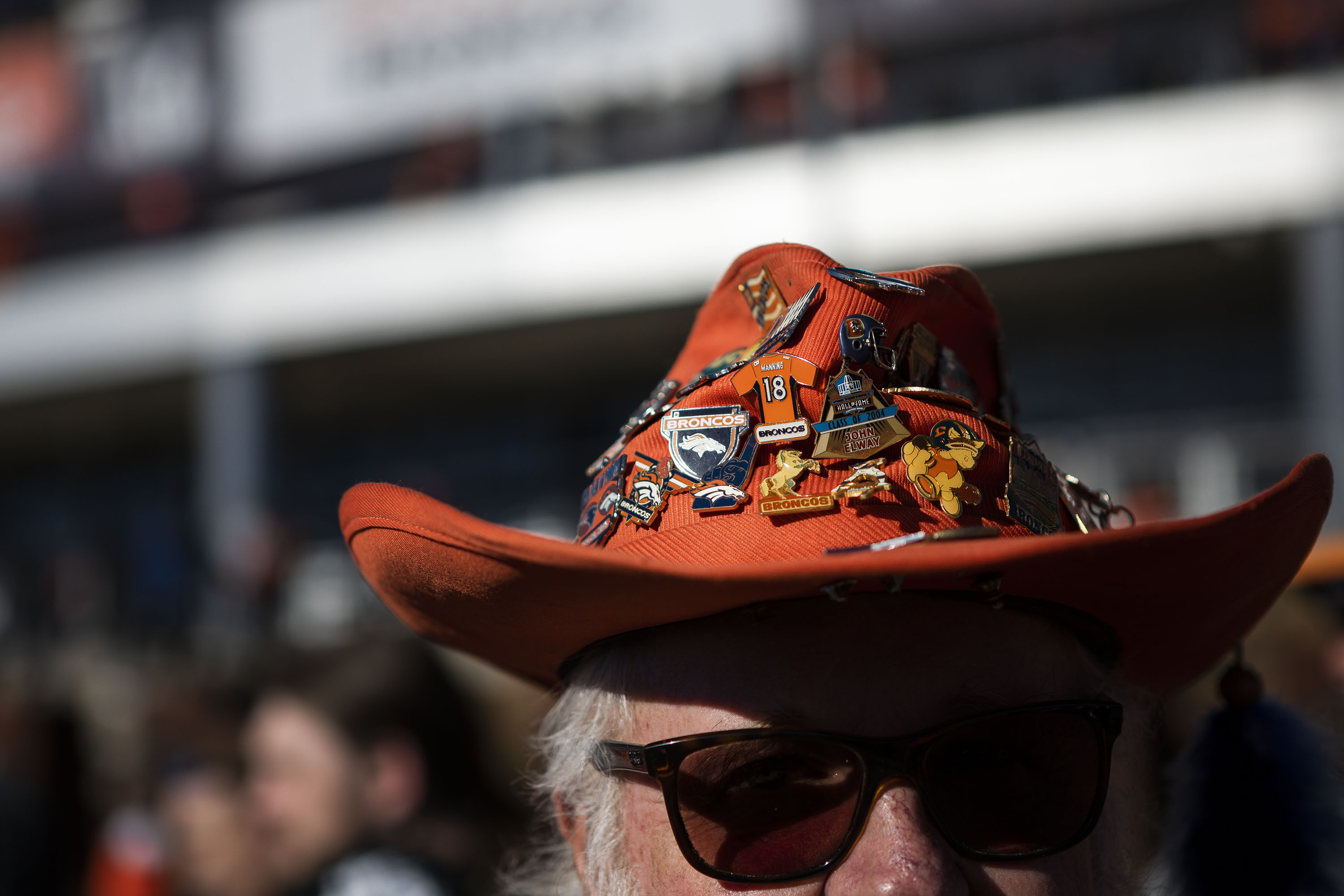 Vail resident Bryan Maesata wears a cowboy hat with pins he’s been collecting for 31 years before the Denver Broncos take on the Cincinnati Bengals on Sunday, Dec. 19, 2021, at Empower Field at Mile High in Denver, Colo. (Timothy Hurst/The Gazette) (Timothy Hurst)