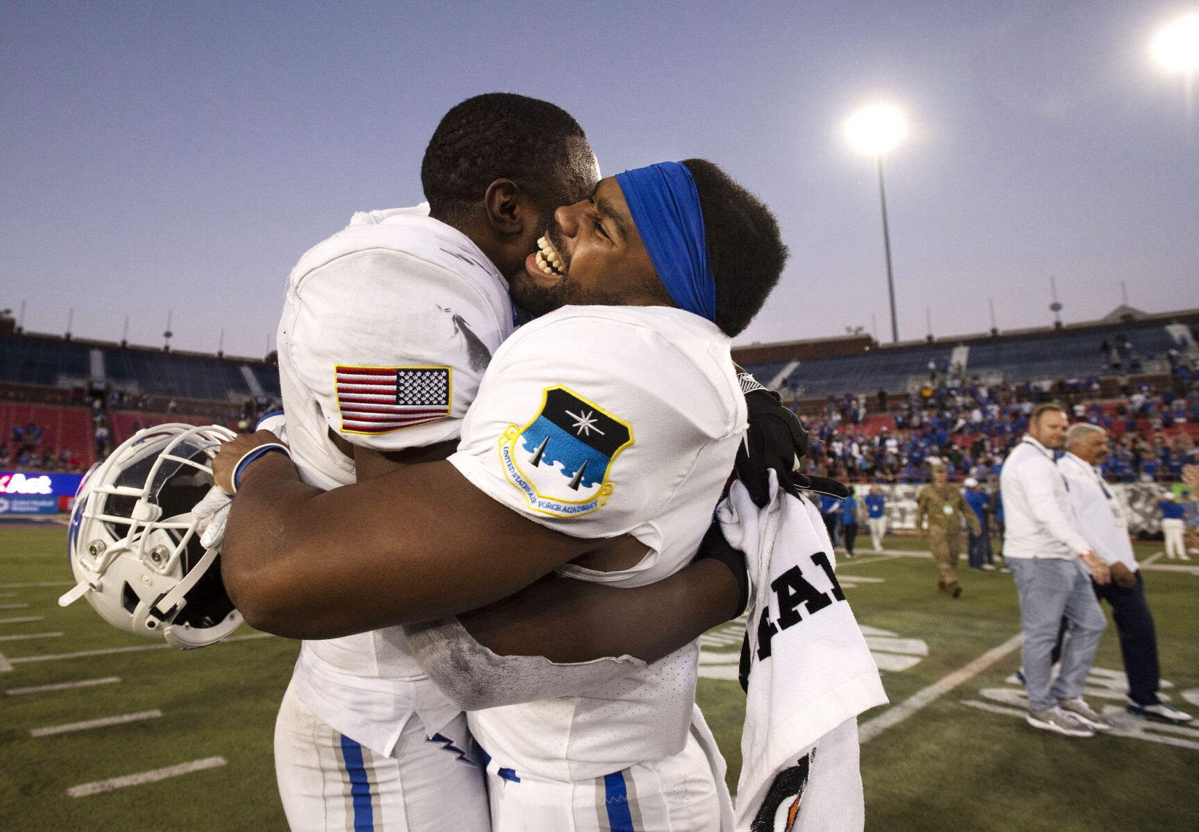 Air Force Falcons junior Zion Kelly (17) and sophomore Jorden Gidrey (15) hug each other as they celebrate their victory after the Air Force Falcons defeat the Louisville Cardinals during the 2021 First Responder Bowl at Gerald J. Ford Stadium on the campus of Southern Methodist University in Dallas, Texas on Tuesday, Dec. 28, 2021. The Falcons won the bowl game by a score of 31-28. (Chancey Bush/ The Gazette) (Chancey Bush/ The Gazette)