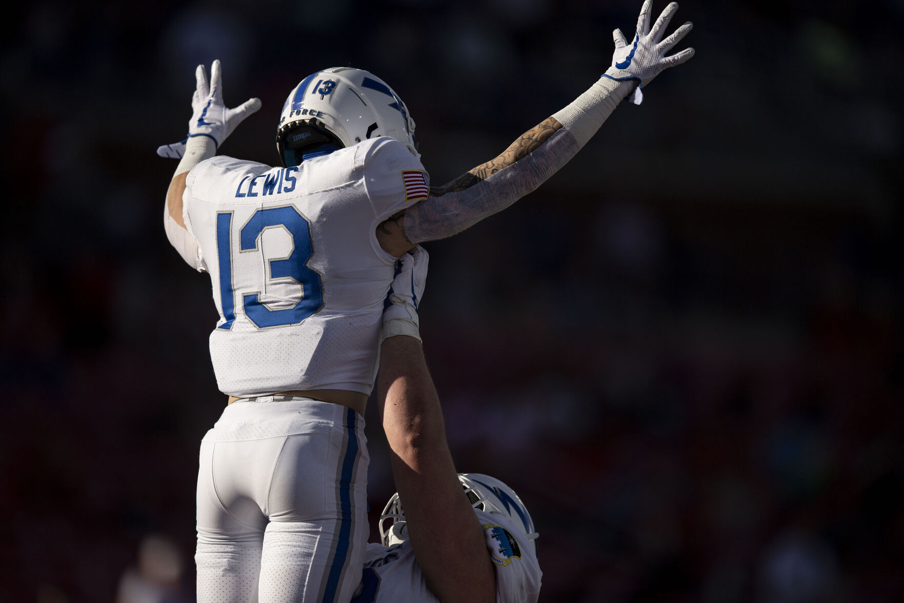 Air Force senior wide receiver Brandon Lewis (13) reacts after a touchdown as the Air Force Falcons take on the Louisville Cardinals during the 2021 First Responder Bowl at Gerald J. Ford Stadium on the campus of Southern Methodist University in Dallas, Texas on Tuesday, Dec. 28, 2021. The Falcons defeated the Cardinals and won the bowl game by a score of 31-28. (Chancey Bush/ The Gazette) (Chancey Bush/ The Gazette)