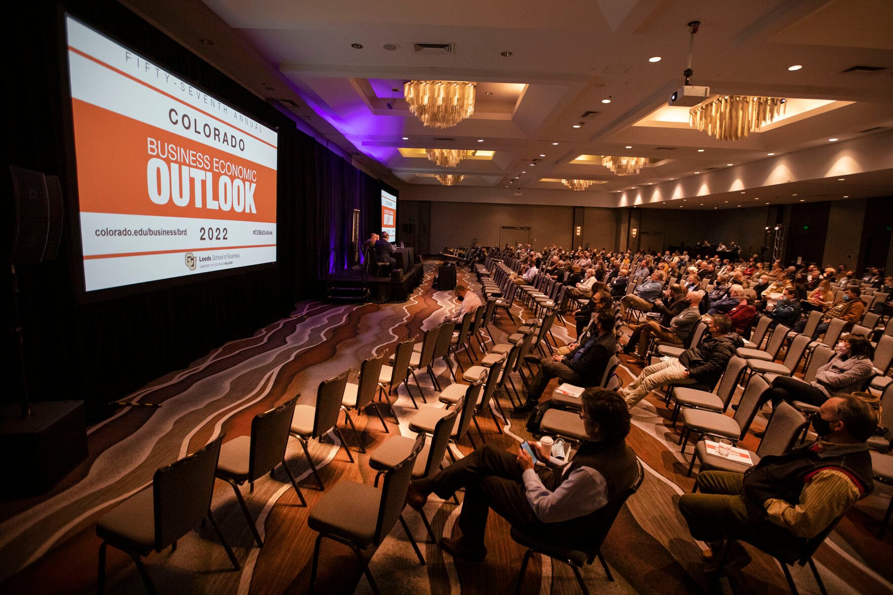 A crowd partially fills the seats of the Colorado Ballroom during the keynote panel discussion about supply chain challenges on Monday at the Grand Hyatt Hotel in Denver. (Timothy Hurst, The Gazette)