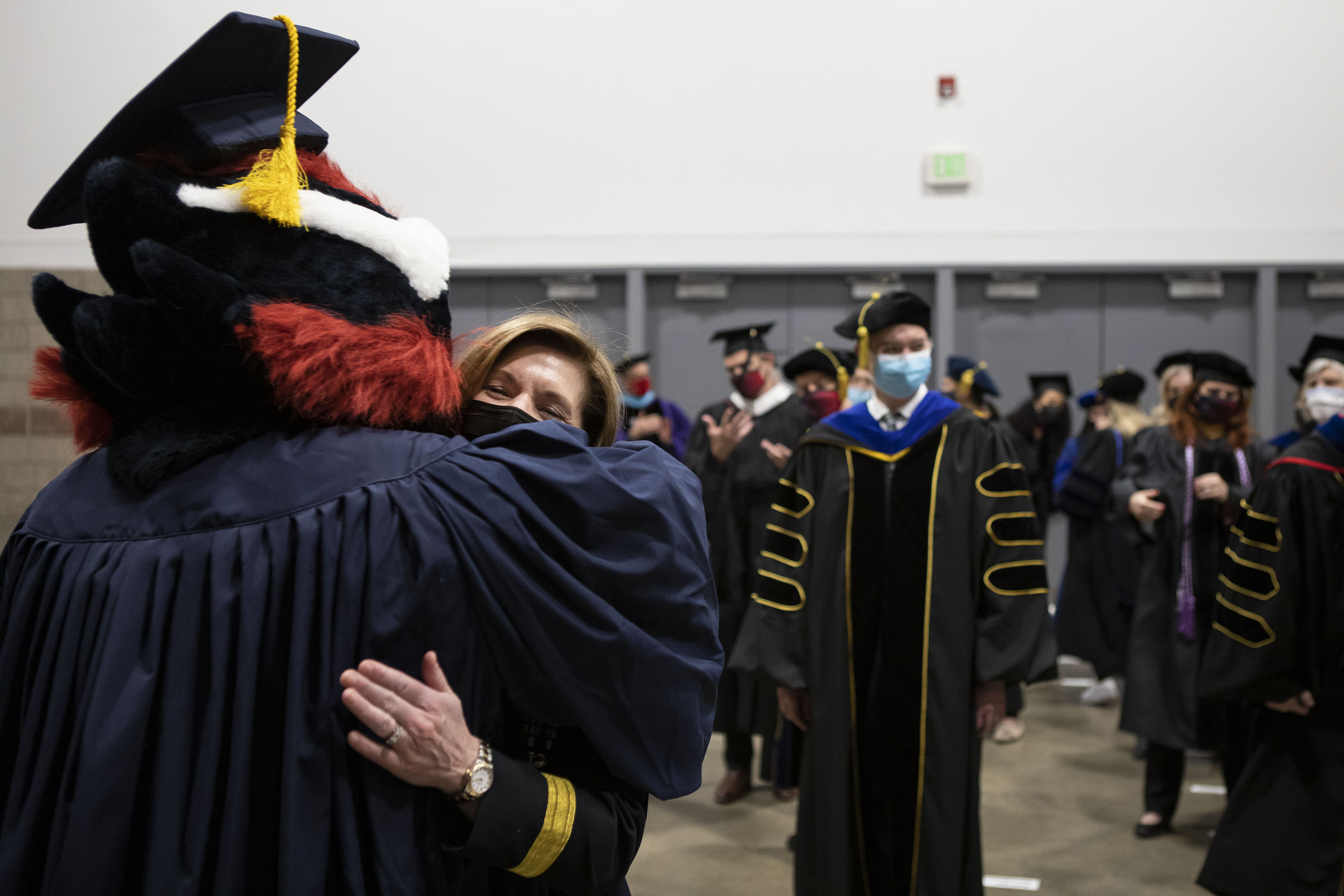 U.S. Army four-star general Laura Richardson hugs Metropolitan State University of Denver mascot Rowdy before a graduation commencement ceremony at the Colorado Convention Center on Friday, Dec. 17, 2021, in Denver, Colo. (TimHursttim.hurst@gazette.comhttps://secure.gravatar.com/avatar/aca82bd62b4ee425c598527cd6faa1b1?d=mm&r=g)