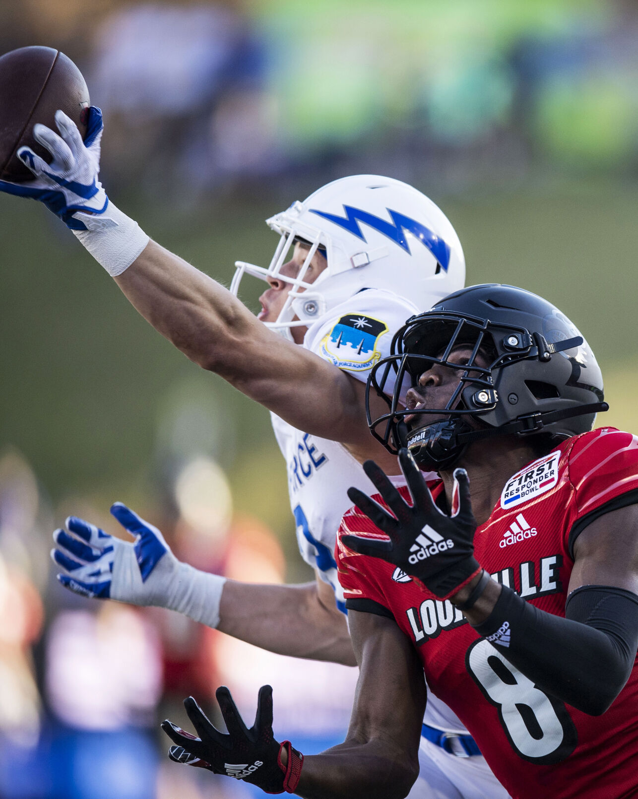 Air Force senior Tre Bugg III (3) breaks up a pass intended for Louisville senior Tyler Harrell (8) during the second quarter as the Air Force Falcons take on the Louisville Cardinals during the 2021 First Responder Bowl at Gerald J. Ford Stadium on the campus of Southern Methodist University in Dallas, Texas on Tuesday, Dec. 28, 2021. (Chancey Bush/ The Gazette) (Chancey Bush/ The Gazette)