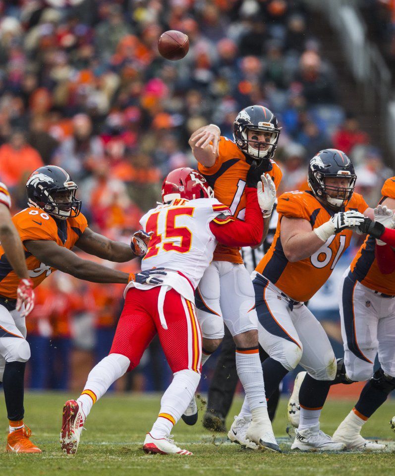 Chiefs inside linebacker Ukeme Eligwe hits Broncos quarterback Paxton Lynch as he throws during the first quarter Sunday, Dec. 31, 2017, at Sports Authority Field at Mile High in Denver. (The Gazette, Christian Murdock) (CHRISTIAN MURDOCK, THE GAZETTE)
