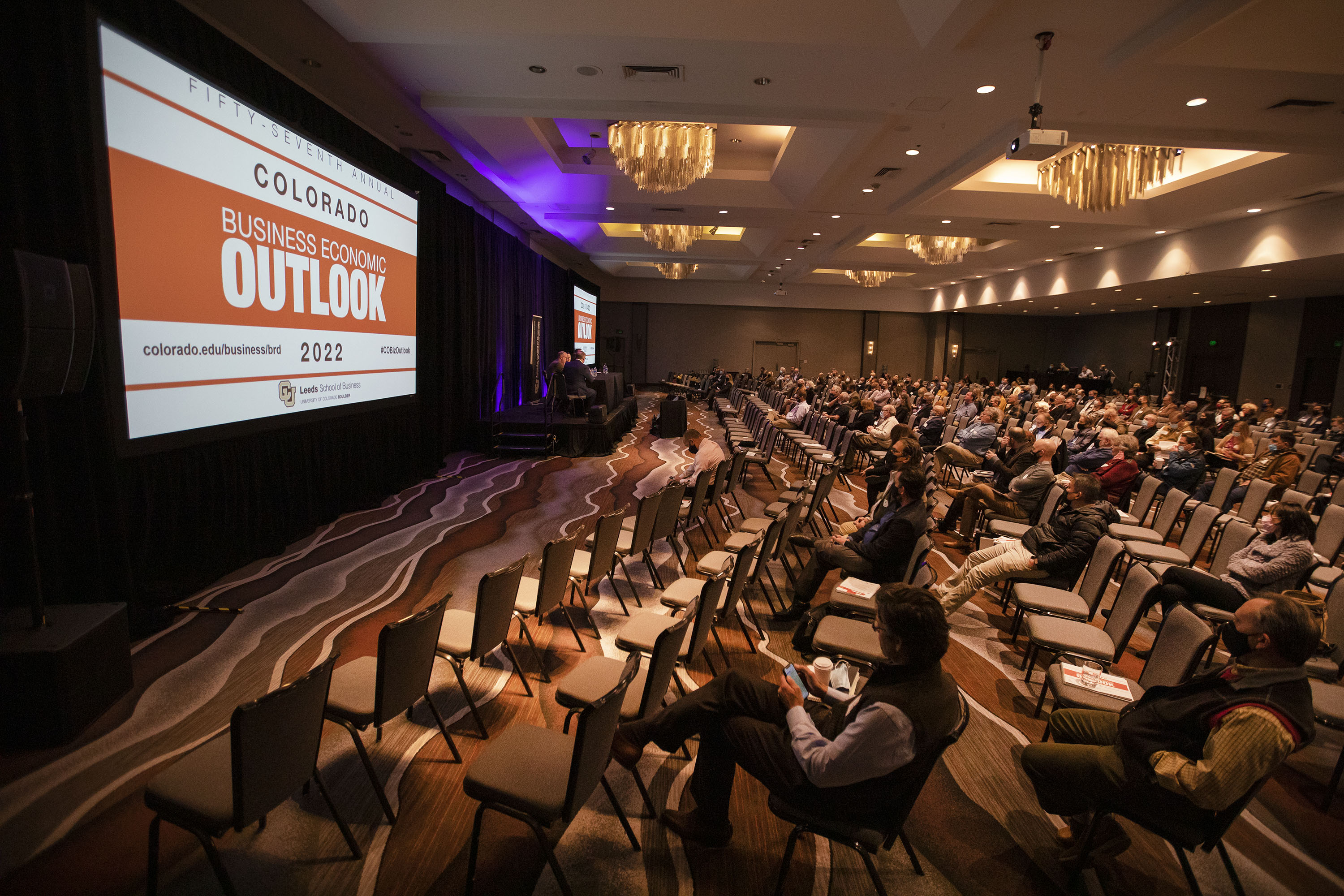 A crowd partially fills the seats of the Colorado Ballroom during the keynote panel discussion about supply chain challenges on Monday, Dec. 6, 2021, during the 57th annual Colorado Business Economic Outlook 2022 at the Grand Hyatt Hotel in Denver, Colo. (TimHursttim.hurst@gazette.comhttps://secure.gravatar.com/avatar/aca82bd62b4ee425c598527cd6faa1b1?d=mm&r=g)