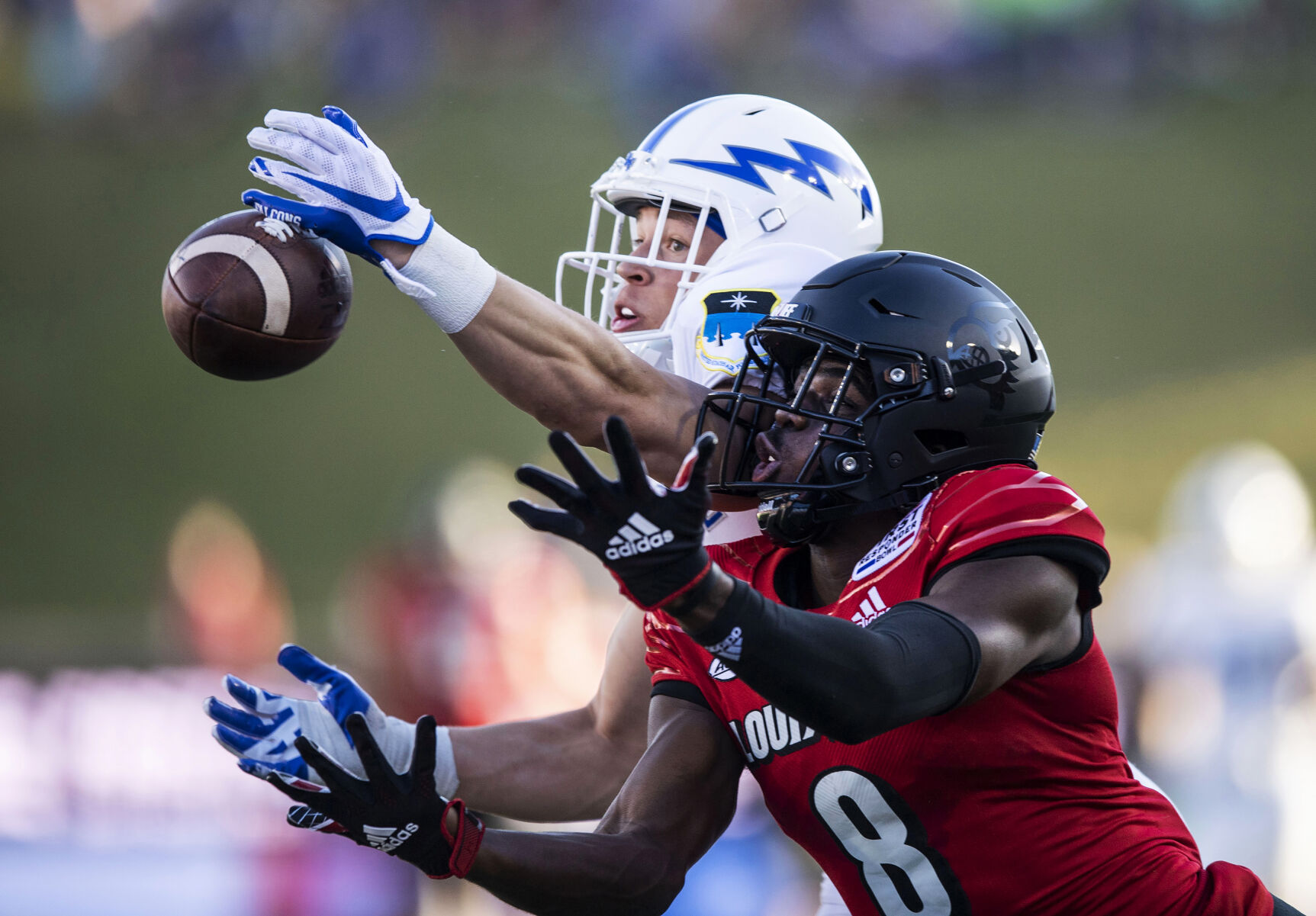 Air Force senior Tre Bugg III (3) breaks up a pass intended for Louisville senior Tyler Harrell (8) during the second quarter as the Air Force Falcons take on the Louisville Cardinals during the 2021 First Responder Bowl at Gerald J. Ford Stadium on the campus of Southern Methodist University in Dallas, Texas on Tuesday, Dec. 28, 2021. (Chancey Bush/ The Gazette) (Chancey Bush/ The Gazette)