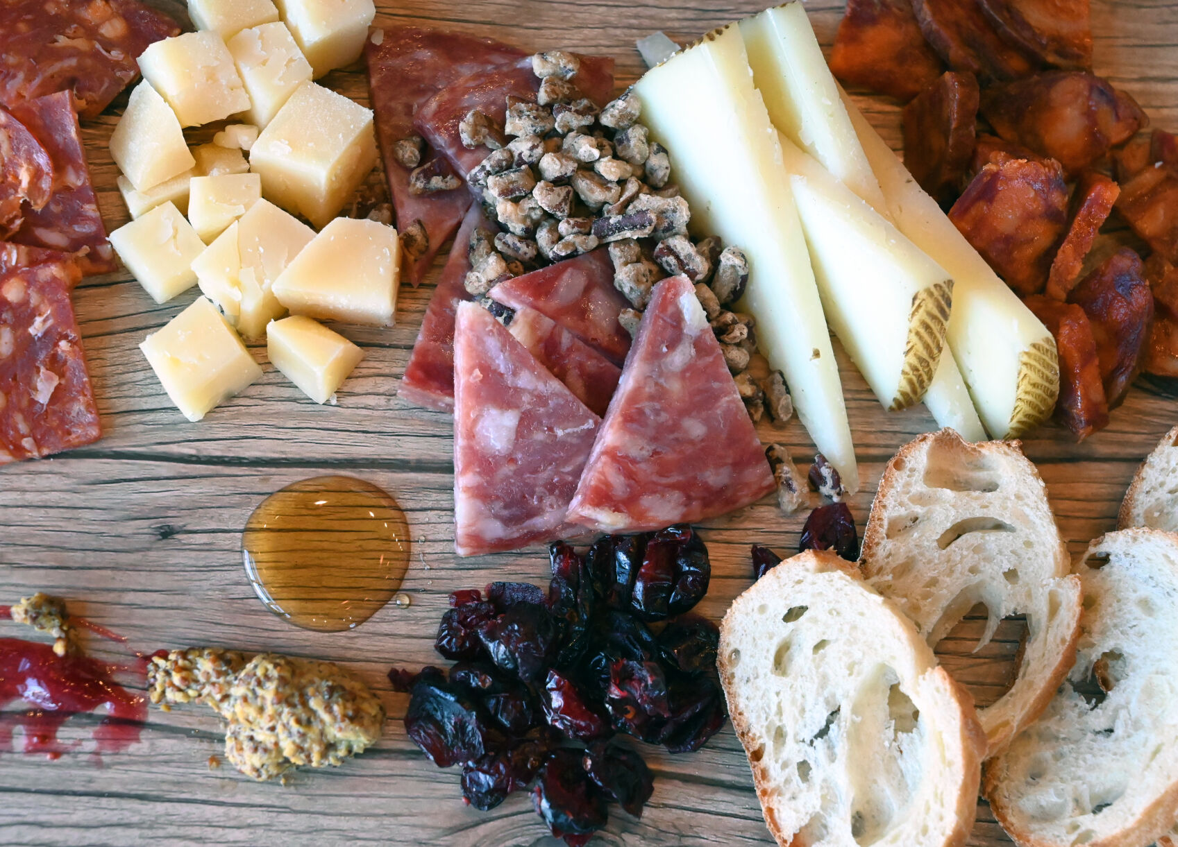 Budget bubbles illustration at Uva Wine Bar, paired with cheese, meats, bread and fruit. (Photo by Jerilee Bennett, The Gazette) (Jerilee Bennett)