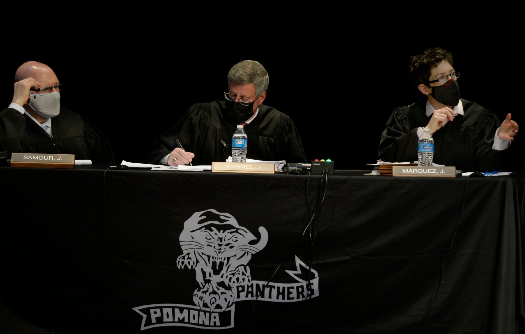 Left to right, Colorado Supreme Court Justices Carlos A. Samour Jr., Richard L. Gabriel, and Monica M. Márquez. The state’s high court has said “The long-established rule in Colorado is that an innocent victim of assault need not retreat before using deadly force if the victim believes the use of such force is necessary for self-protection.” (Kathryn Scott for Colorado Politics)