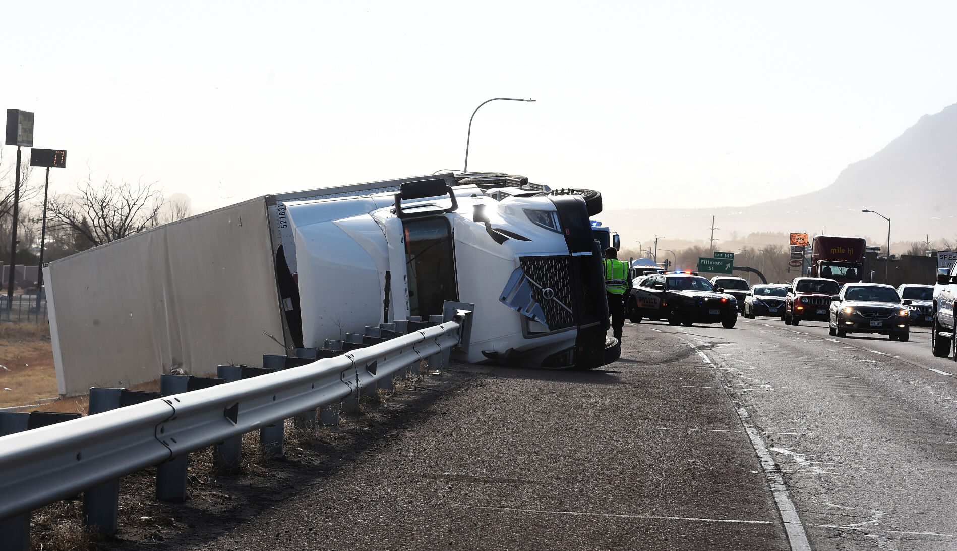 High winds toppled a semi-truck on I-25 in the northbound lane just past Garden of the Gods Rd. on Wednesday, Dec. 15, 2021. (Photo by Jerilee Bennett, The Gazette) (Jerilee Bennett)