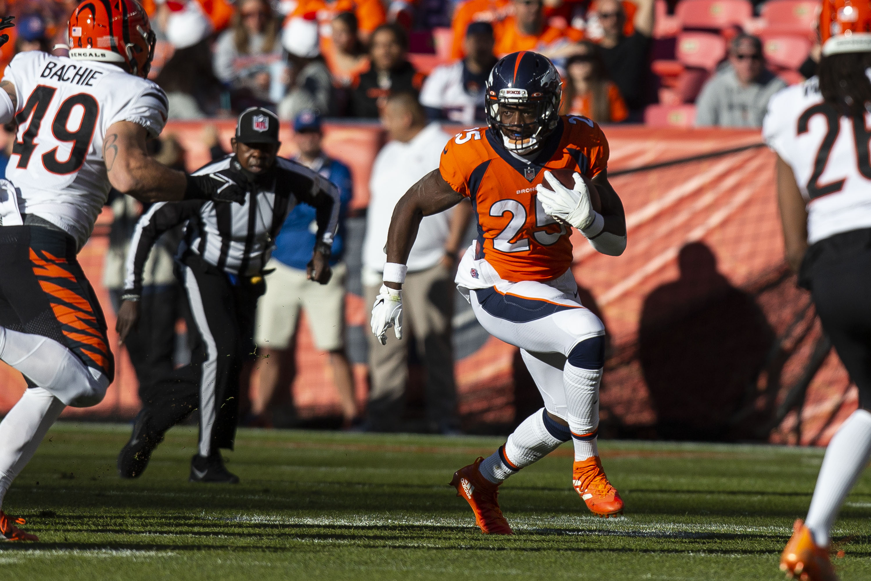 Denver Broncos running back Melvin Gordon III (25) turns upfield while rushing against the Cincinnati Bengals on Sunday, Dec. 19, 2021, at Empower Field at Mile High in Denver, Colo. (Timothy Hurst/The Gazette) (TimHursttim.hurst@gazette.comhttps://secure.gravatar.com/avatar/aca82bd62b4ee425c598527cd6faa1b1?d=mm&r=g)