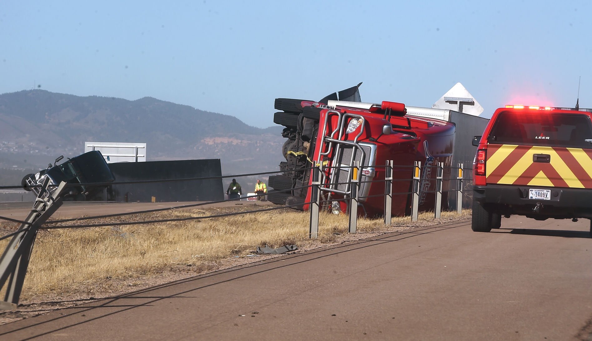 Two semi trucks, one southbound and one northbound, were part of the truck carnage on I-25 Wednesday, Dec. 15, 2021. These trucks were north of Briargate Pkwy. Over a dozen semi trucks were blown over by high winds in the Pikes Peak region on I-25. (Photo by Jerilee Bennett, The Gazette) (Jerilee Bennett)