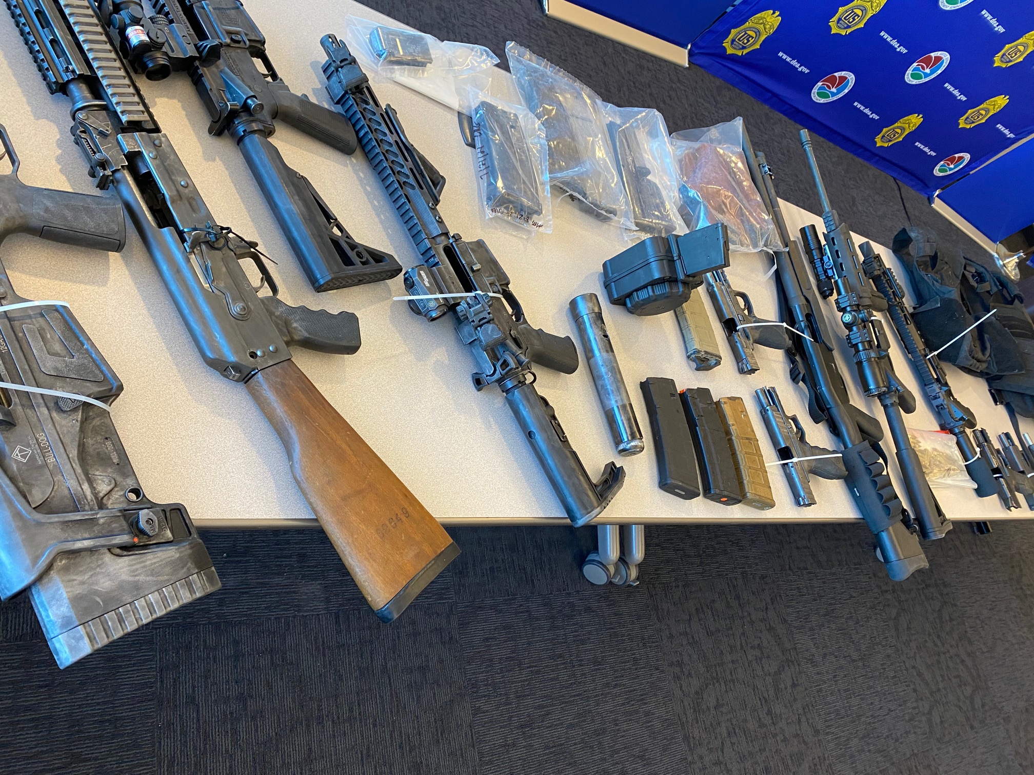The DEA put on display a range of assault weapons and ammunition which were seized in an 8 month drug sting operation. (Carol McKinley)