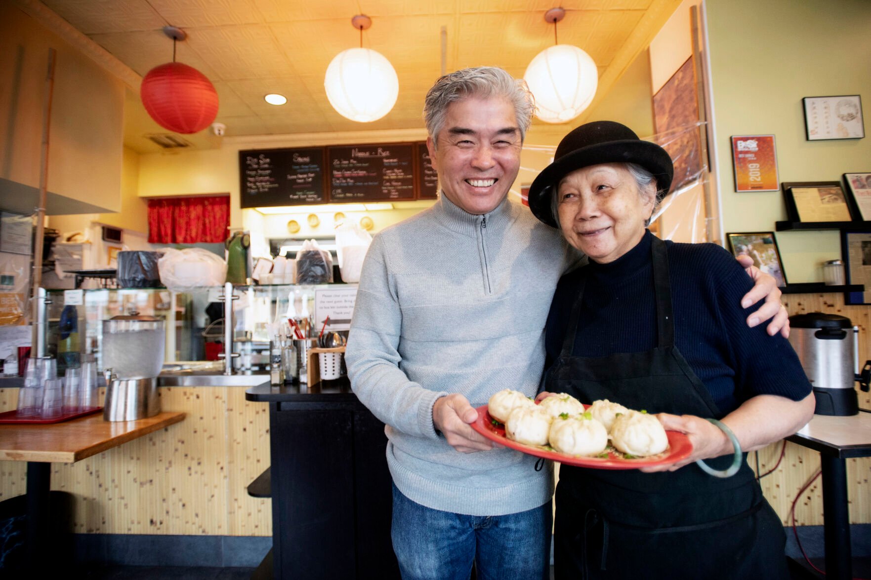 Edwin Zoe and his mother. Anna Zoe, 78, who is known as Ma Ma, pose for a portrait at their restaurant, Zoe Ma Ma, in Boulder. Zoe Ma Ma is known for homemade Chinese cuisine using organic ingredients. (Chancey Bush, The Gazette)