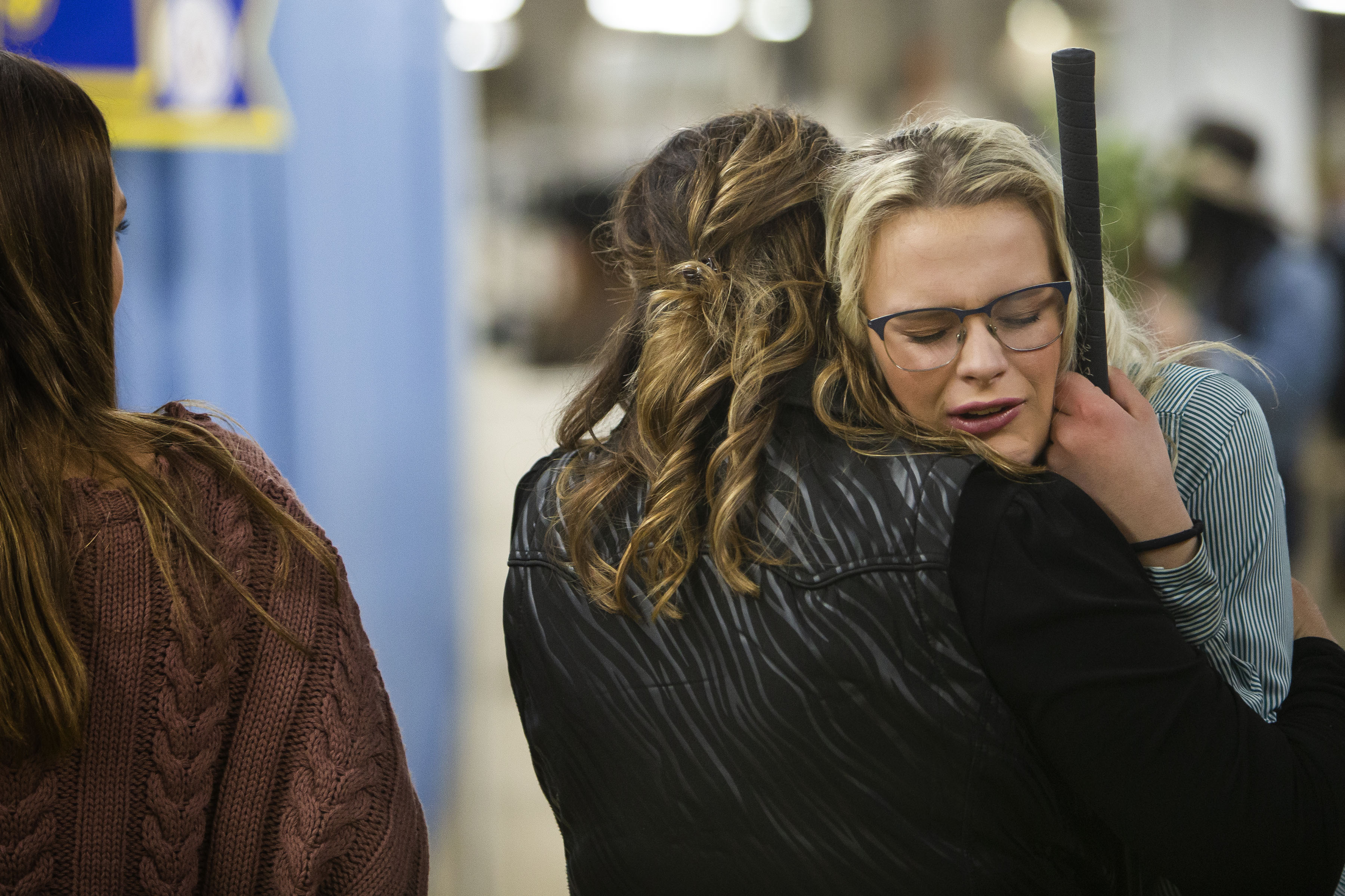 Cami Miller of El Dorado, Kansas, is comforted by her mother Charlene Miller after auctioning off her grand champion catch-a-calf during the National Western Stock Show Junior Livestock Champions Auctions on Friday, Jan. 21, 2022, in Denver, Colo. (Timothy Hurst/The Gazette) (Timothy Hurst)