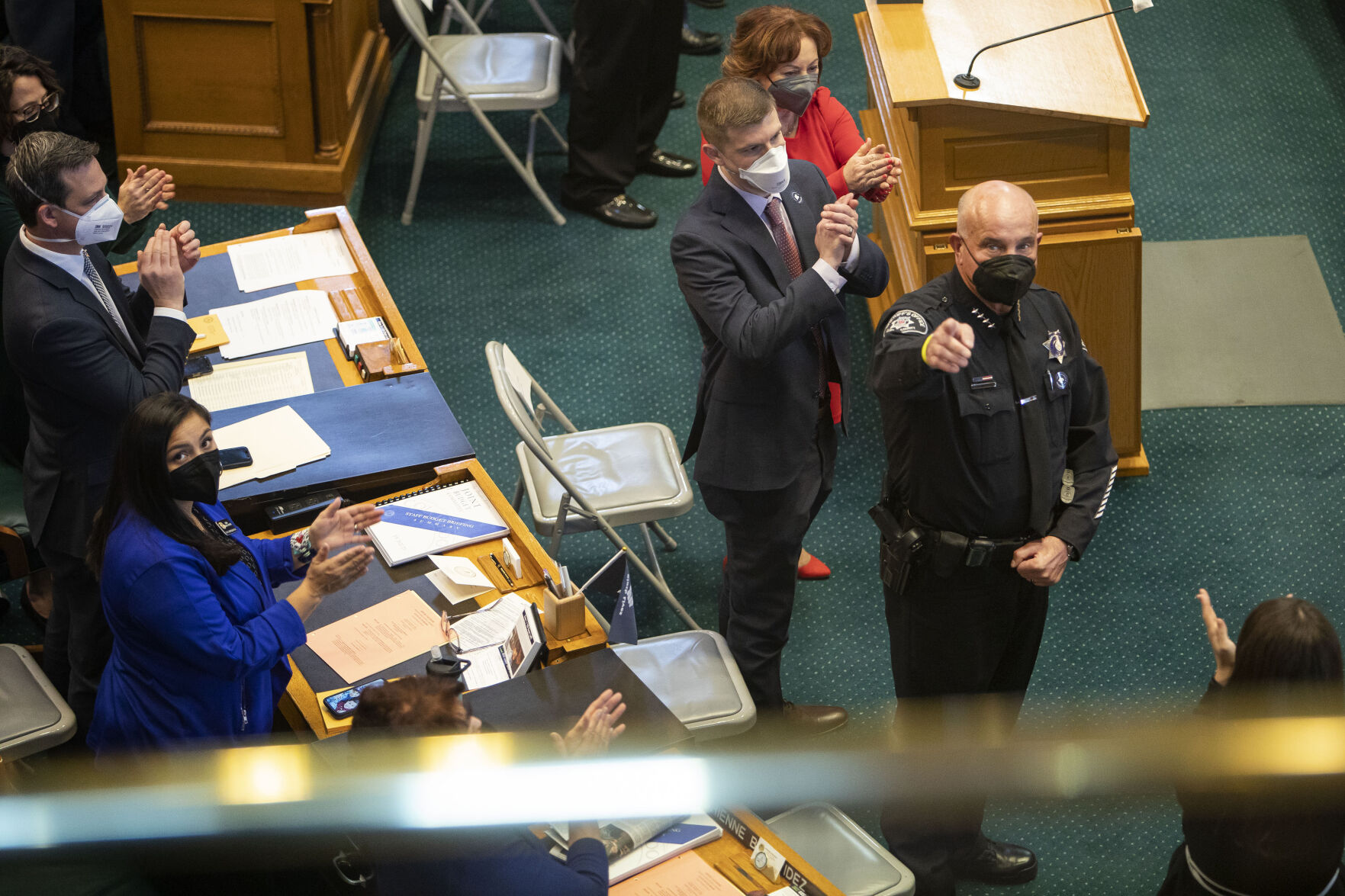 Boulder County Sheriff Joe Pelle points to other law enforcement in the gallery above the floor while they are honored by Gov. Jared Polis during his State of the State address on Thursday, Jan. 13, 2022, in Denver, Colo. (Timothy Hurst/The Gazette) (Timothy Hurst)