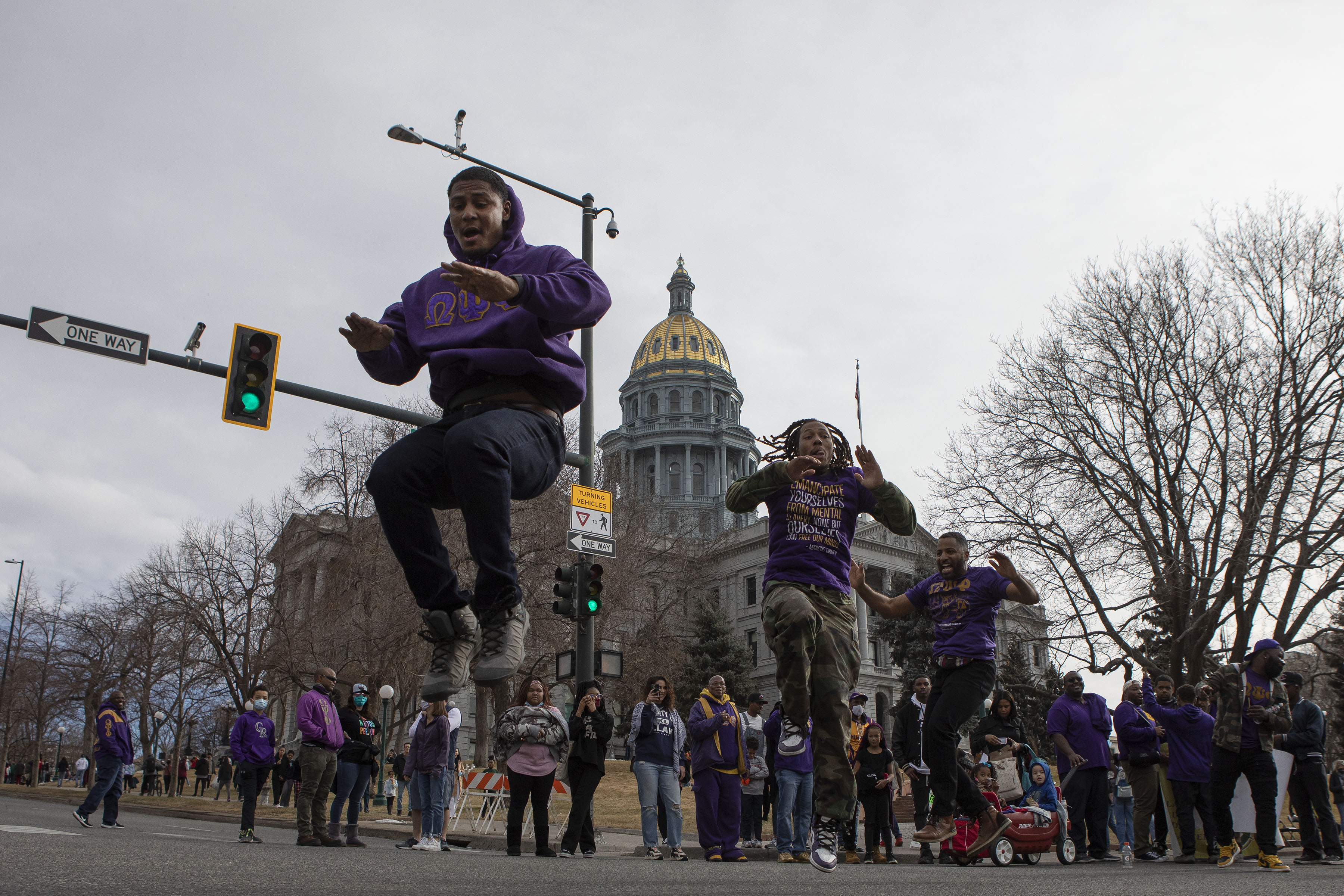 Omega Psi Phi fraternity members dance in front of the State Capitol Building during the Martin Luther King Marade on Monday, Jan. 17, 2022, in Denver, Colo. (Timothy Hurst/The Gazette) (Timothy Hurst)