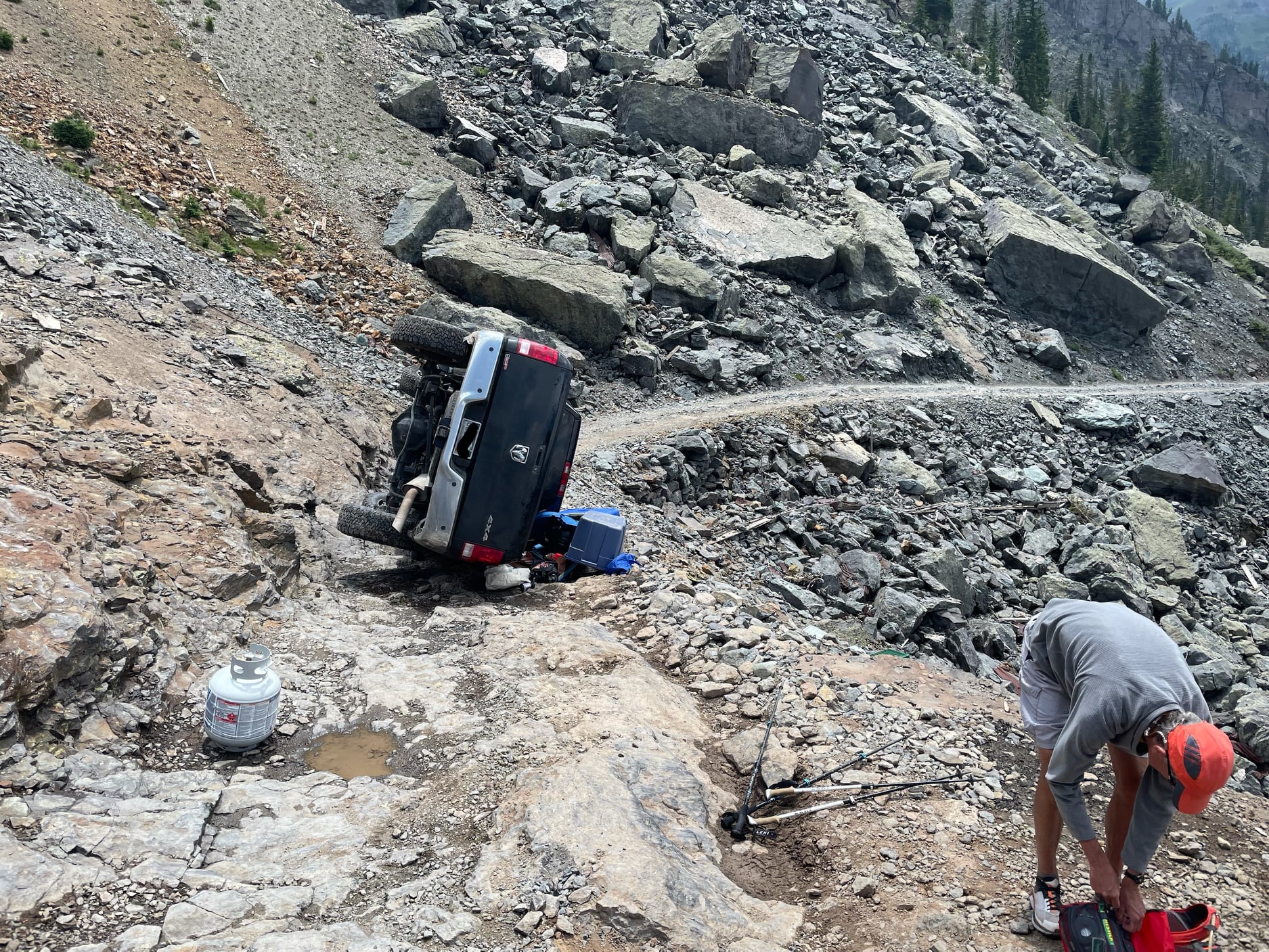 A pick-up truck involved in a rollover crash on the notorious Black Bear Pass. Photo via San Miguel County Sheriff.