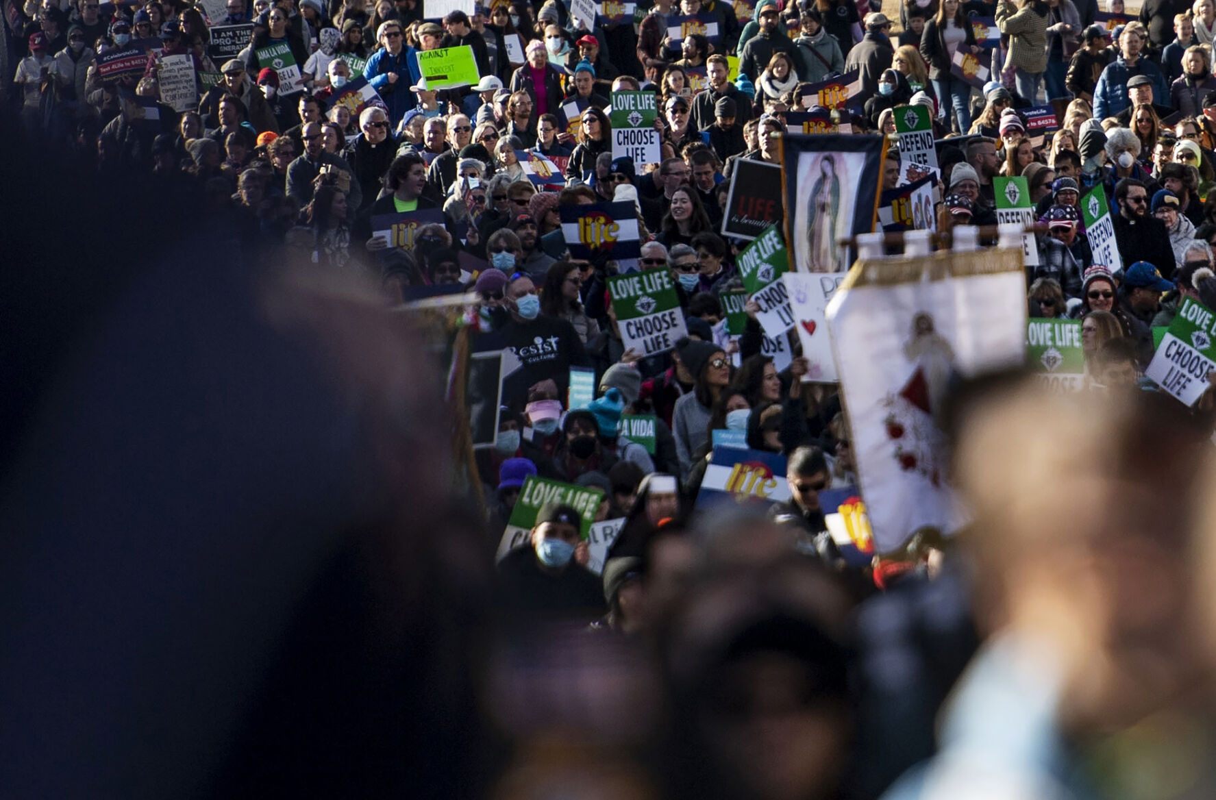 Thousands of people march Saturday during the Celebrate Life Rally and March, hosted by the Archdiocese of Denver and Respect Life Denver, at the state Capitol building in Denver. Thousands attended the annual event honoring courageous mothers. (PHOTOS BY Chancey Bush, The Gazette)