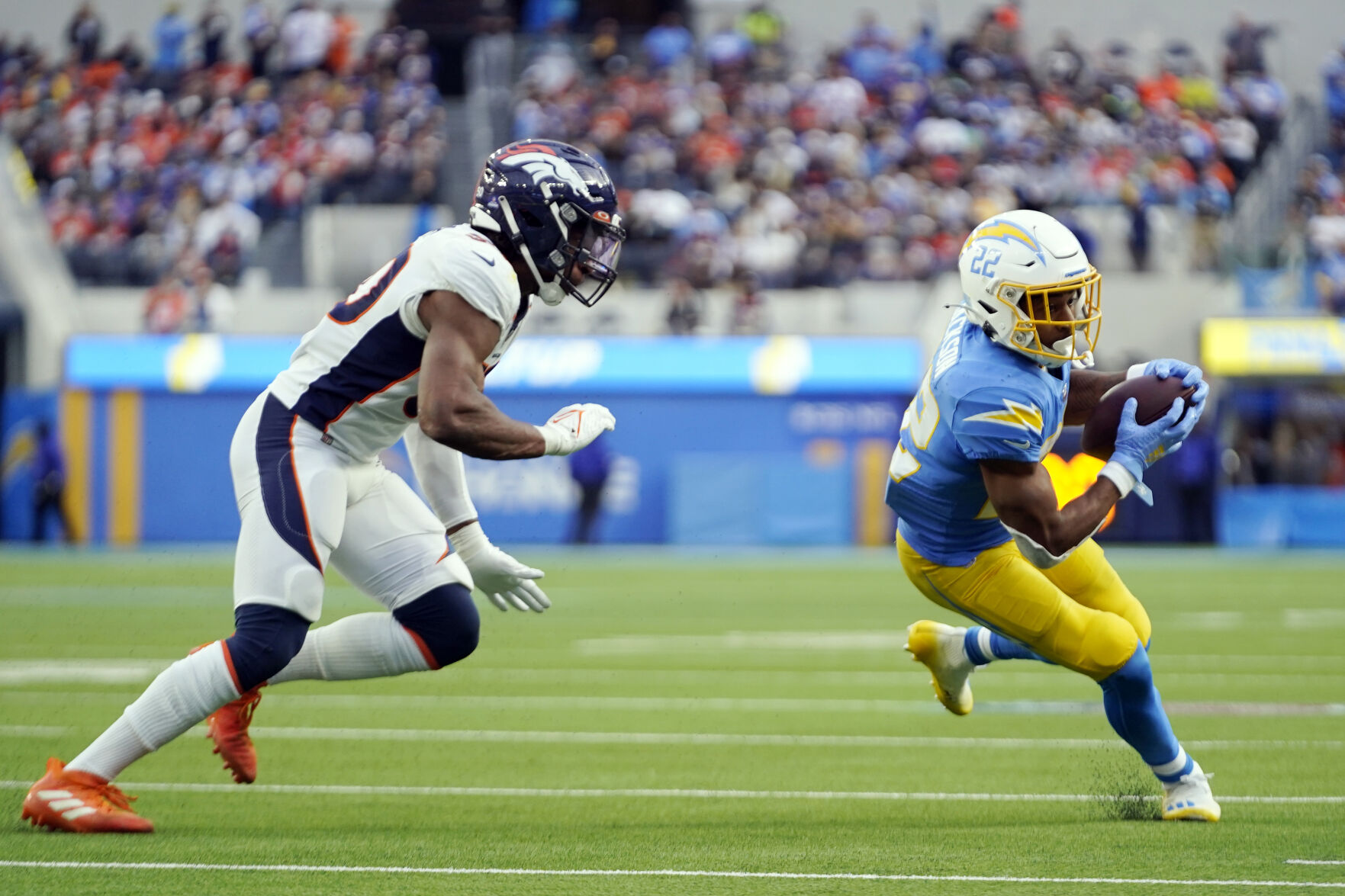 Los Angeles Chargers running back Justin Jackson (22) runs against the Denver Broncos during the first half of an NFL football game Sunday, Jan. 2, 2022, in Inglewood, Calif. (AP Photo/Ashley Landis) (Ashley Landis)