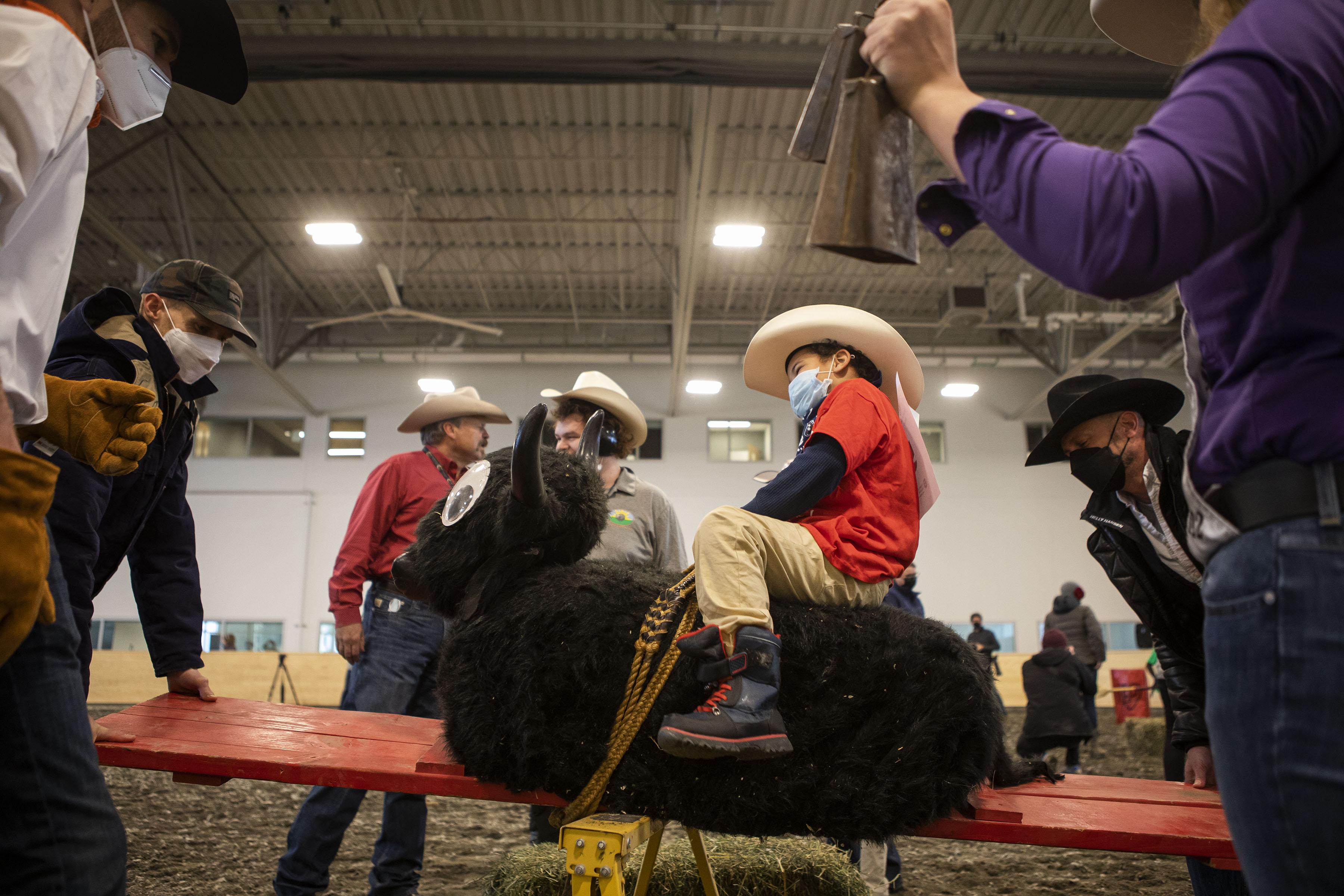 Jeremiah Garner, 6, laughs as he rides the rocking bull during the Exceptional Rodeo in the Temple Grandin Equine Center on Thursday, Jan. 20, 2022, at the CSU Spur Campus in Denver, Colo. (Timothy Hurst/The Gazette) (Timothy Hurst)