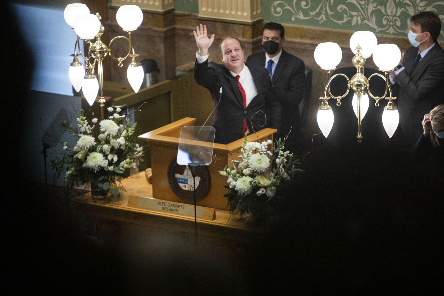 Gov. Jared Polis waves to the gallery as he wraps up his State of the State address on Thursday, Jan. 13, 2022, in Denver, Colo. (Timothy Hurst/The Gazette) (Timothy Hurst)